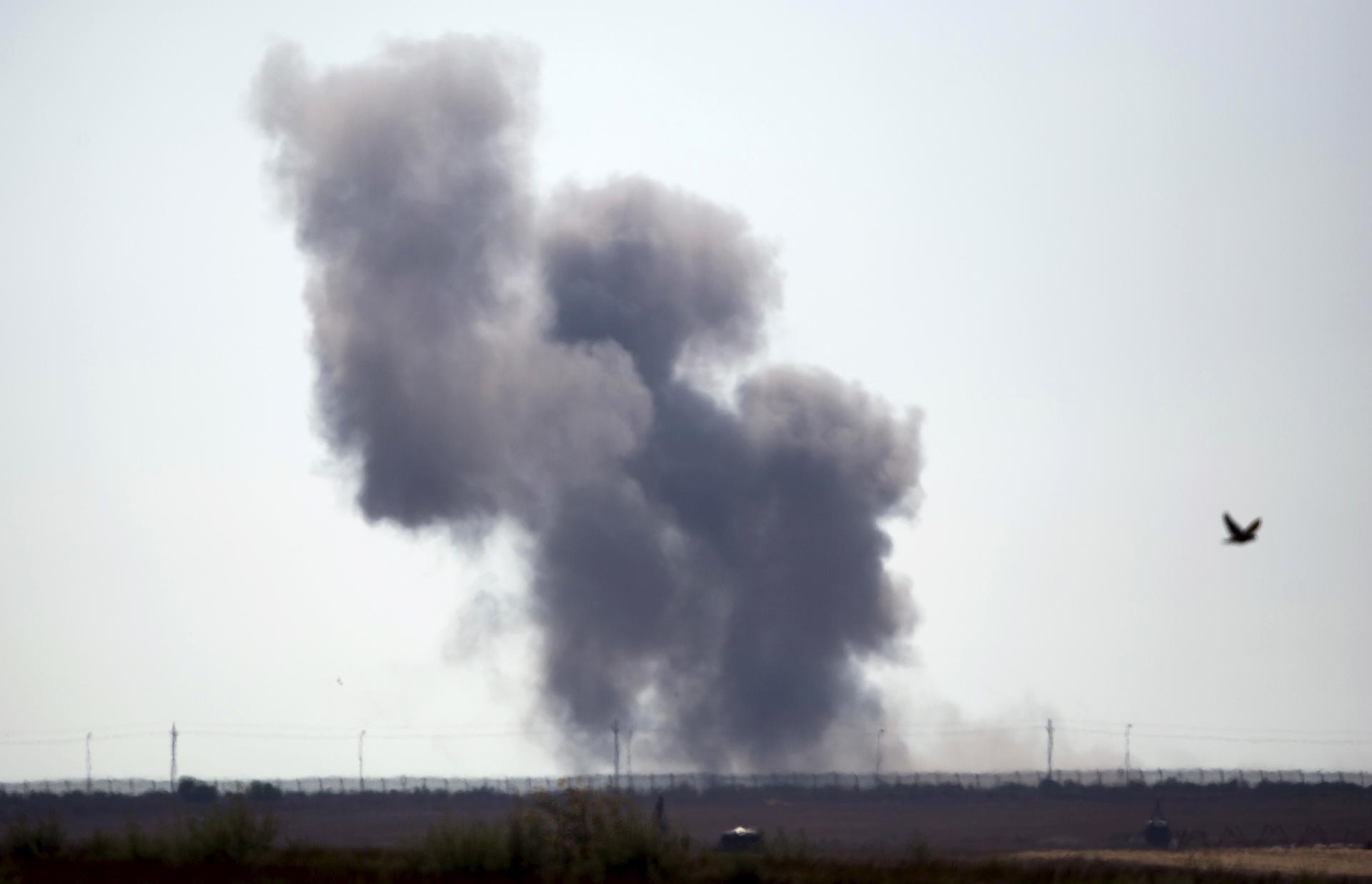 Smoke rises in Egypt as Islamic State militants launched a wide-scale coordinated assault on several military checkpoints in the northern Sinai, along the border with southern Israel