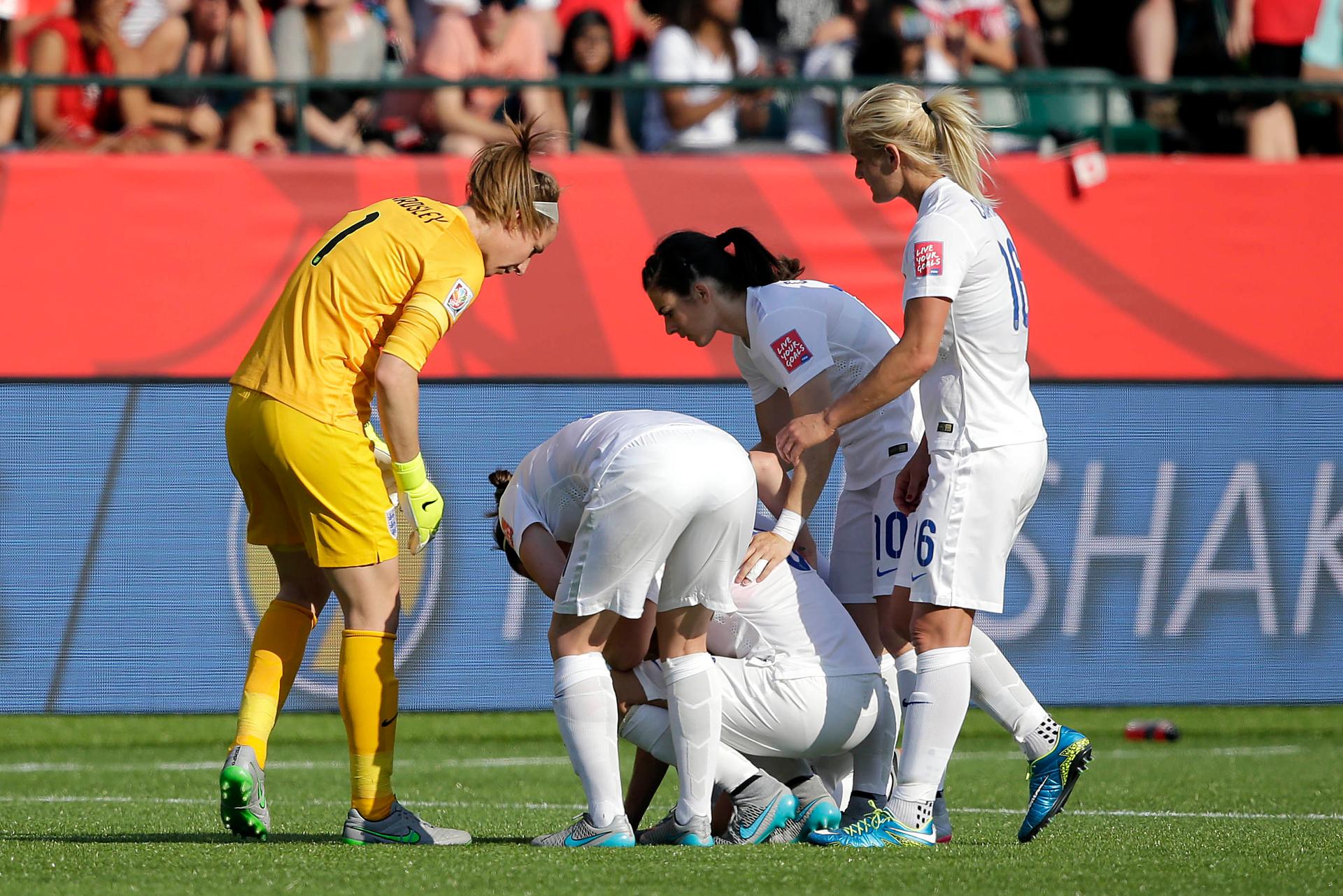 England reacts with England defender Laura Bassett (6) after she scored an own goal during the second half against Japan in the semifinals of the FIFA 2015 Women's World Cup at Commonwealth Stadium.