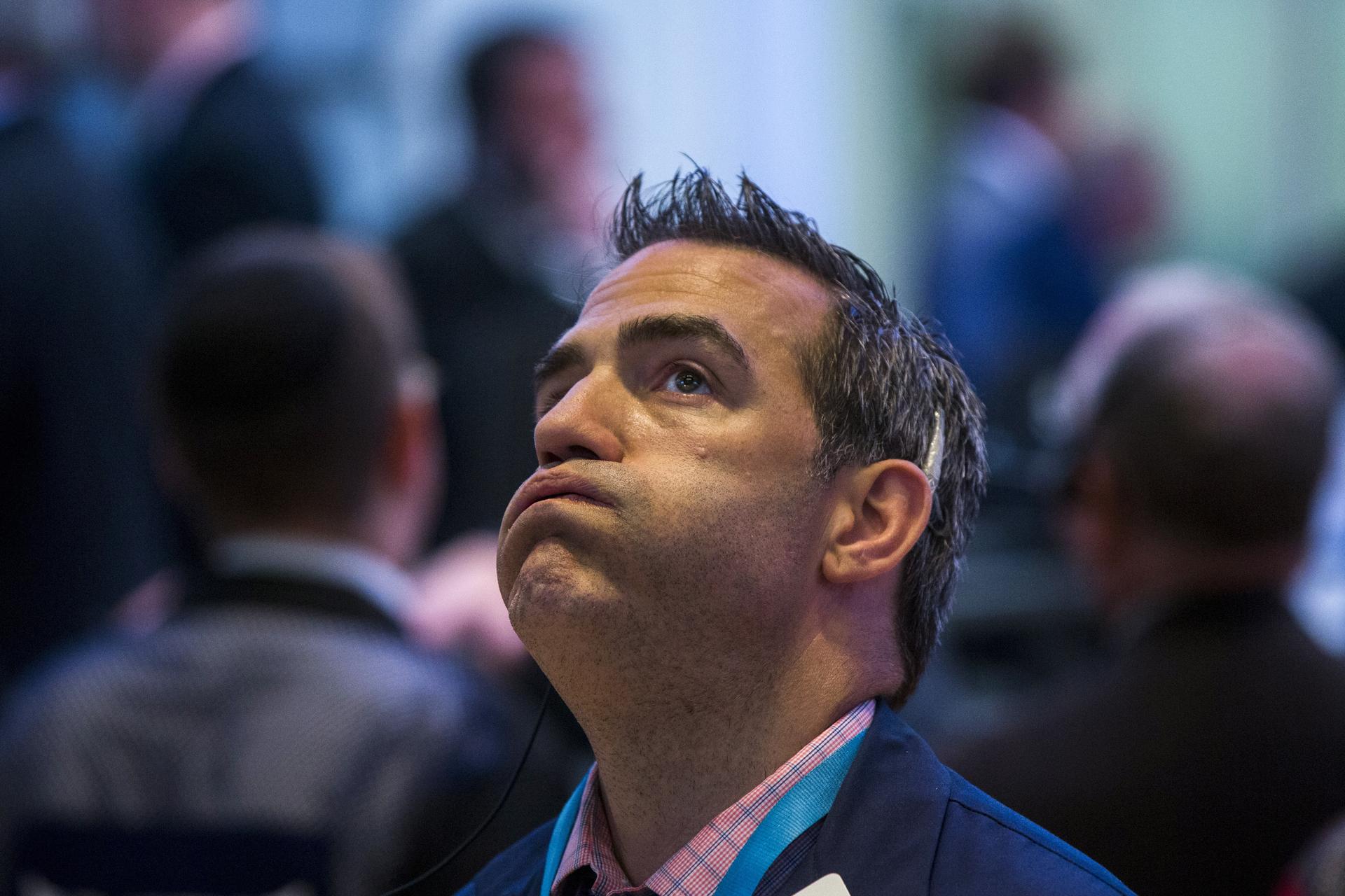 A trader waits for the NYSE to come back online