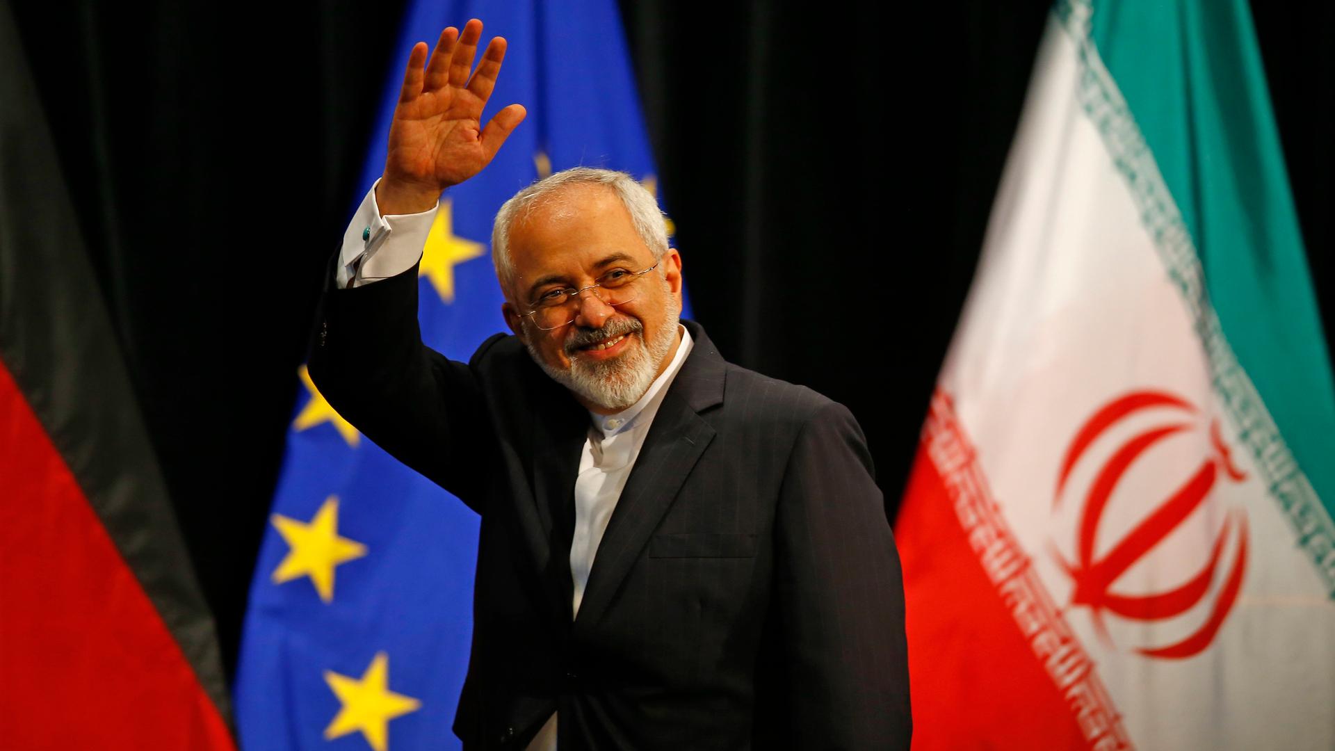 Iranian Foreign Minister Mohammad Javad Zarif waves after a plenary session at the United Nations building in Vienna, Austria July 14, 2015.