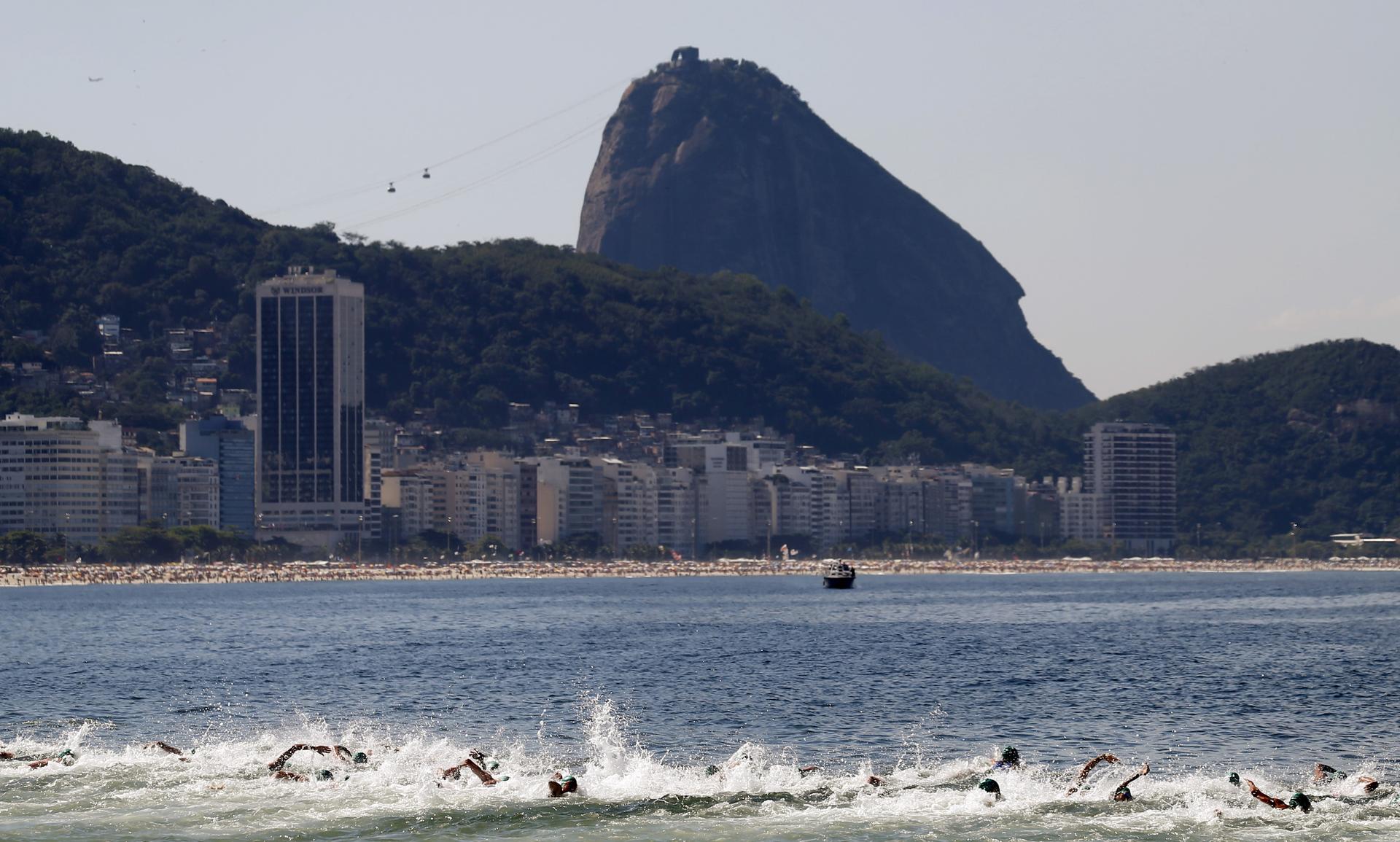 Competitors swim on Copacabana beach in Rio de Janeiro, Brazil