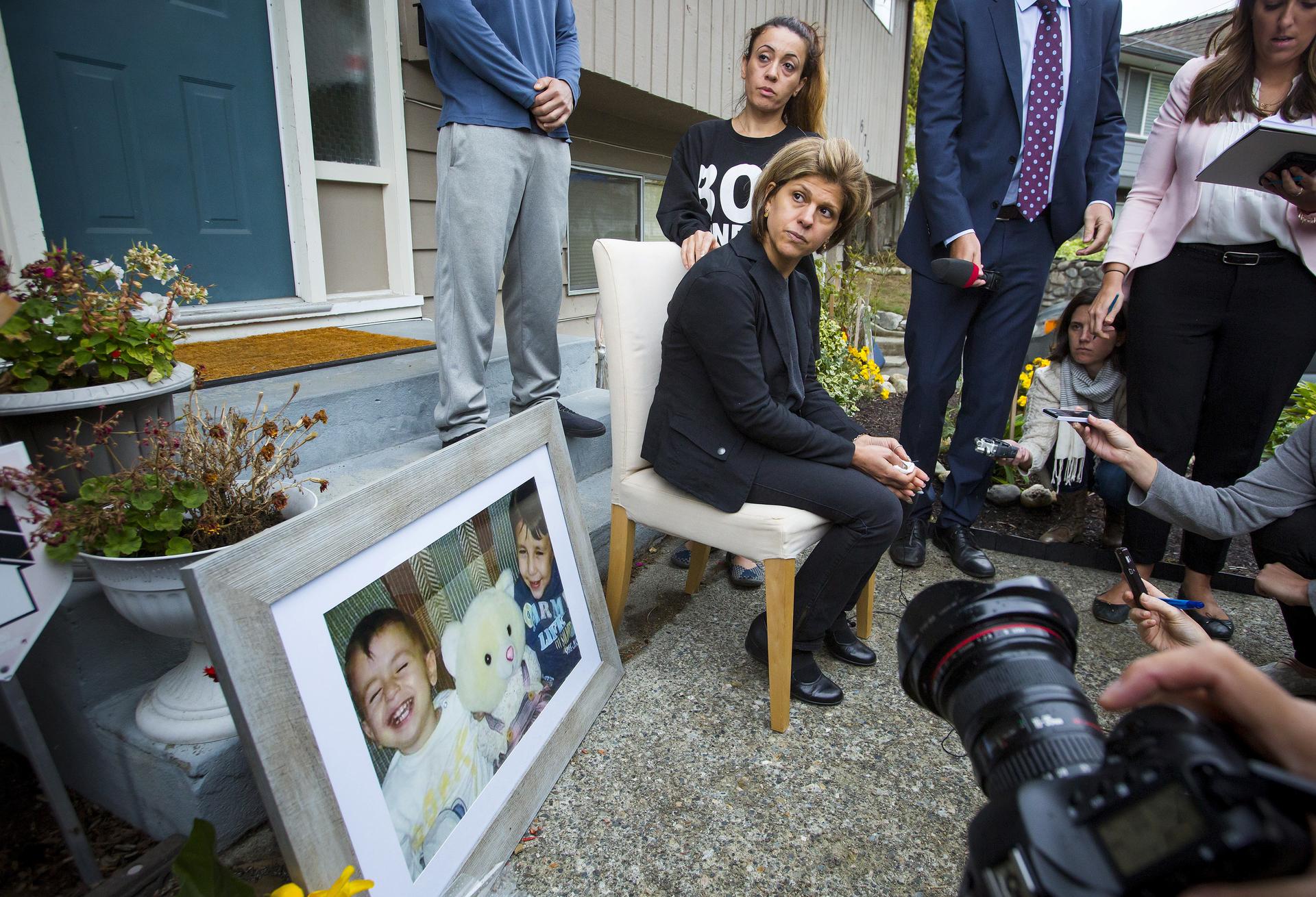 Tima Kurdi, sister of Syrian refugee Abdullah Kurdi, whose sons Alan and Galip and wife Rehan were among 12 people who drowned in Turkey trying to reach Greece, cries while speaking to the media outside her home in British Columbia.