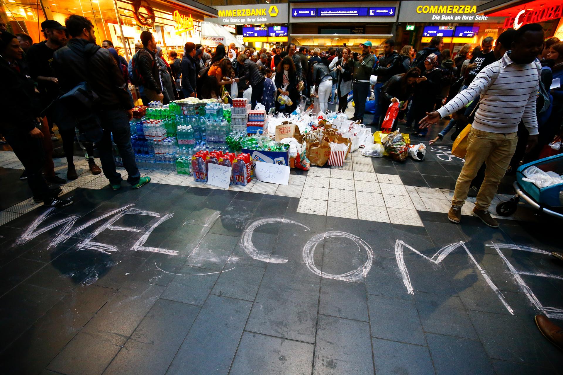 Water, food, and a welcome sign greeted refugees who reached Frankfurt, Germany