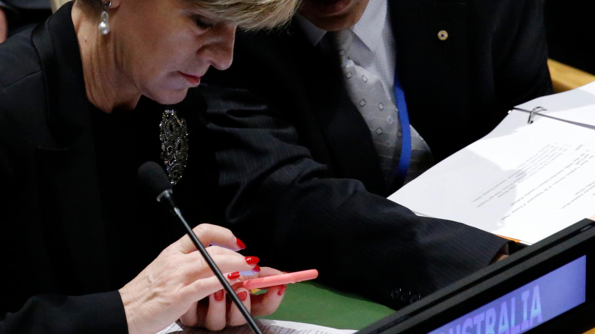 Australian Minister for Foreign Affairs Julie Bishop confers with a member of her delegation during the 70th session of the United Nations General Assembly at the U.N. headquarters in Manhattan, New York.