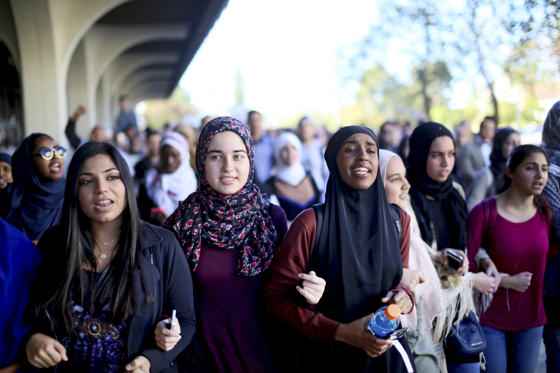 Students chant while marching at a rally against Islamophobia at San Diego State University in San Diego, California.