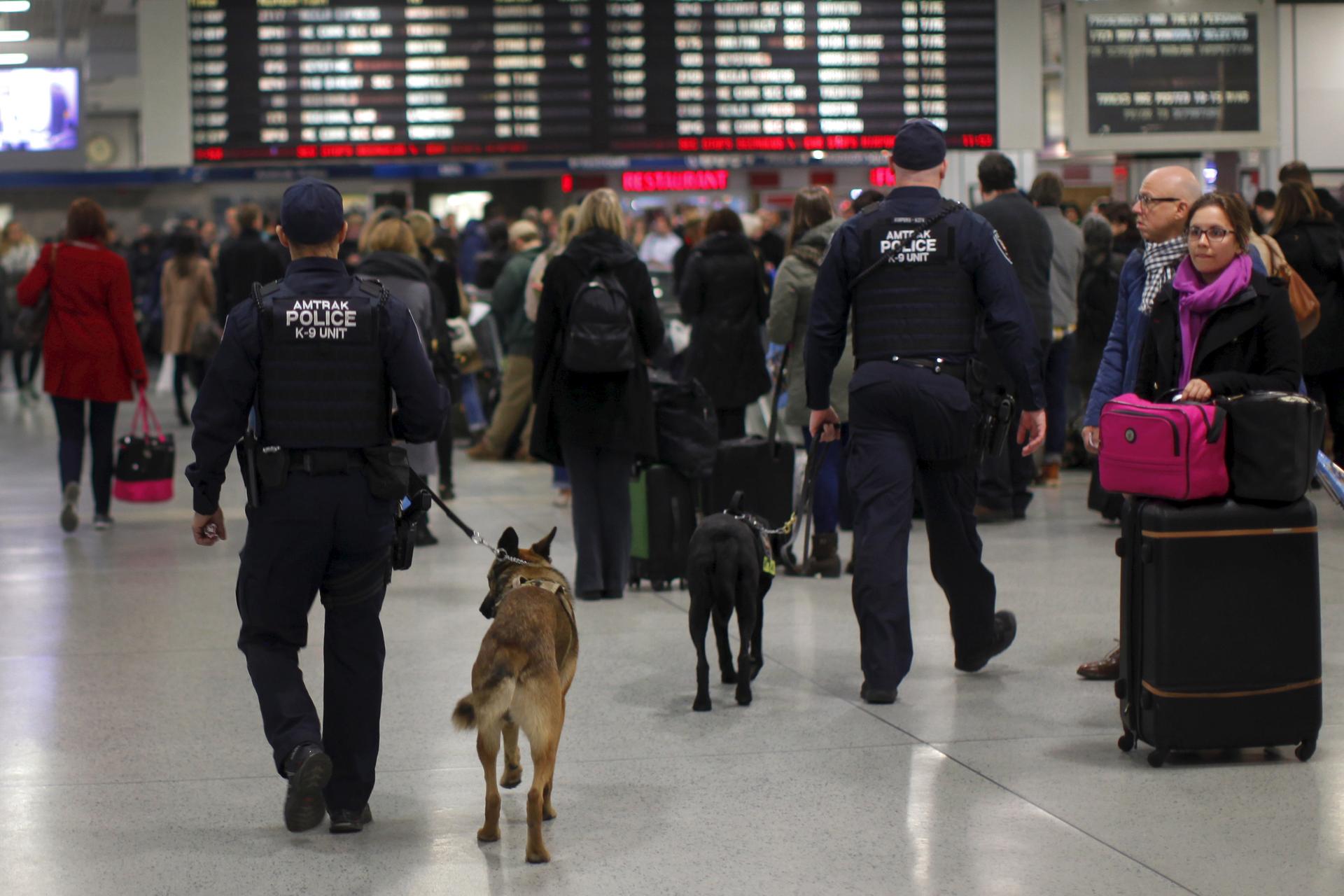 Amtrak Police K-9 teams patrol a busy Pennsylvania Station in the Manhattan borough of New York City, November 25, 2015.