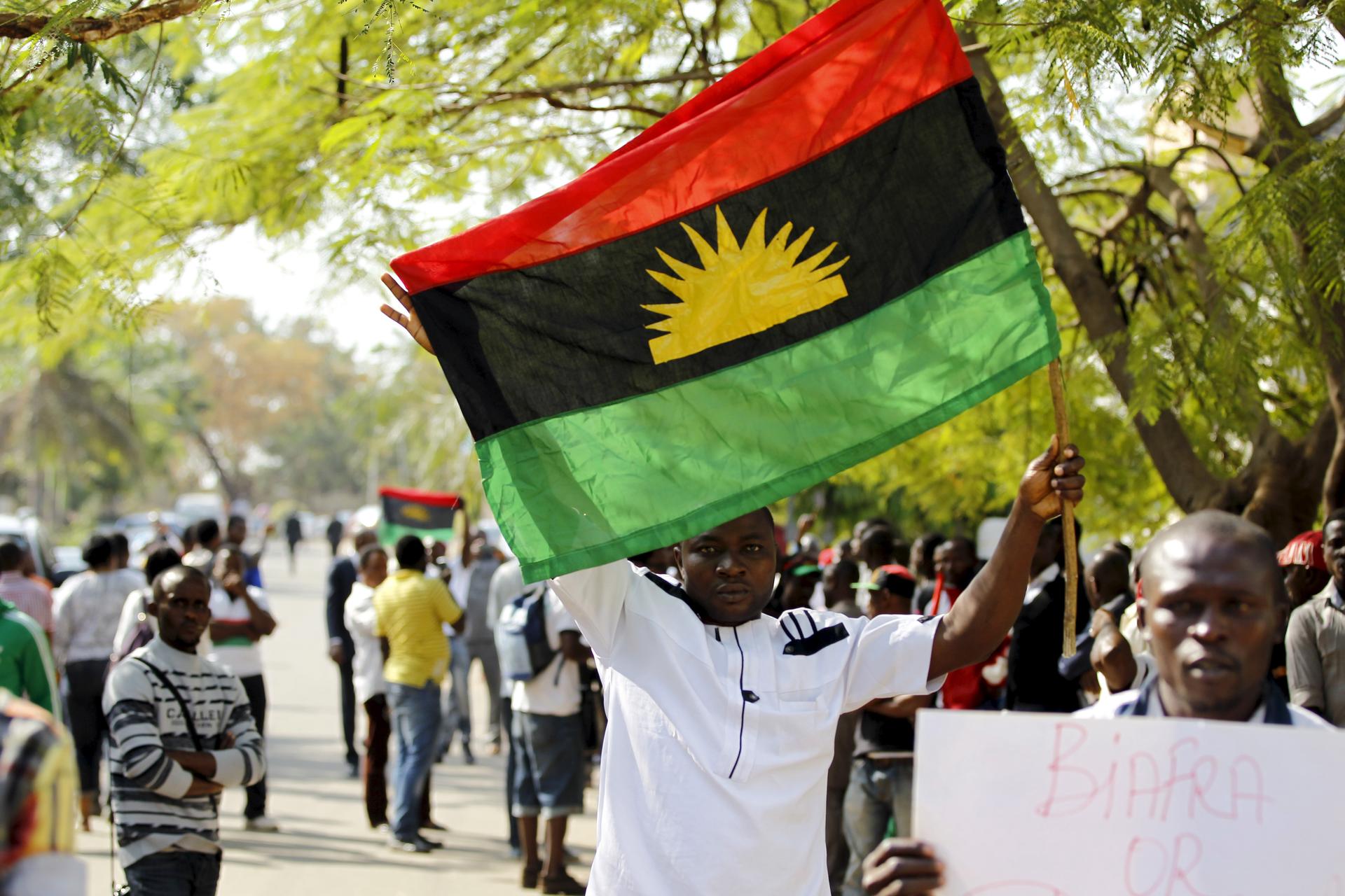 A supporter of Indigenous People of Biafra leader Nnamdi Kanu holds a Biafra flag during a rally in support of Kanu, who was arrested on charges of criminal conspiracy and belonging to an illegal societyAbuja, Nigeria December 1, 2015.