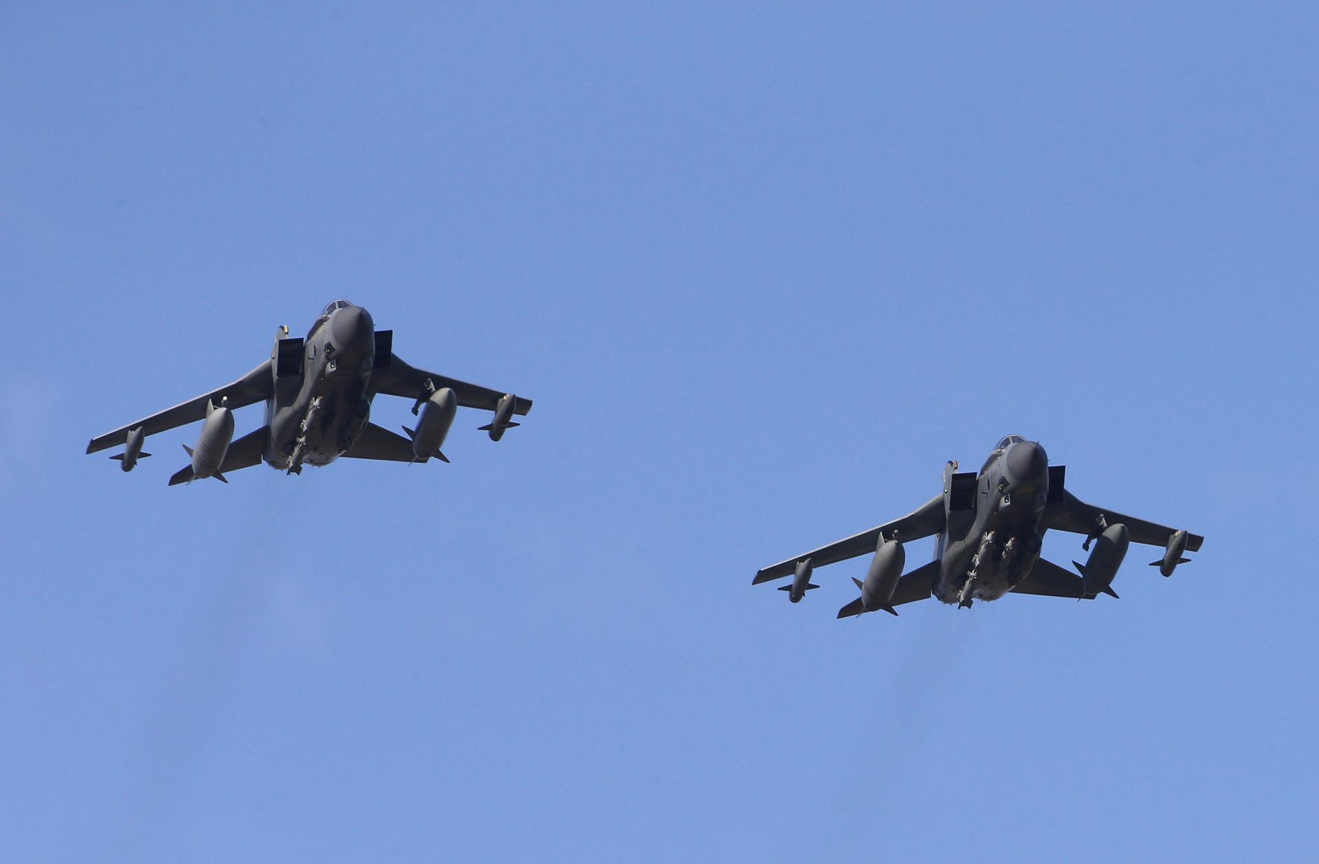 Two British Tornados make a fly past before landing after returning from a mission, at RAF Akrotiri, southern Cyprus December 3, 2015.
