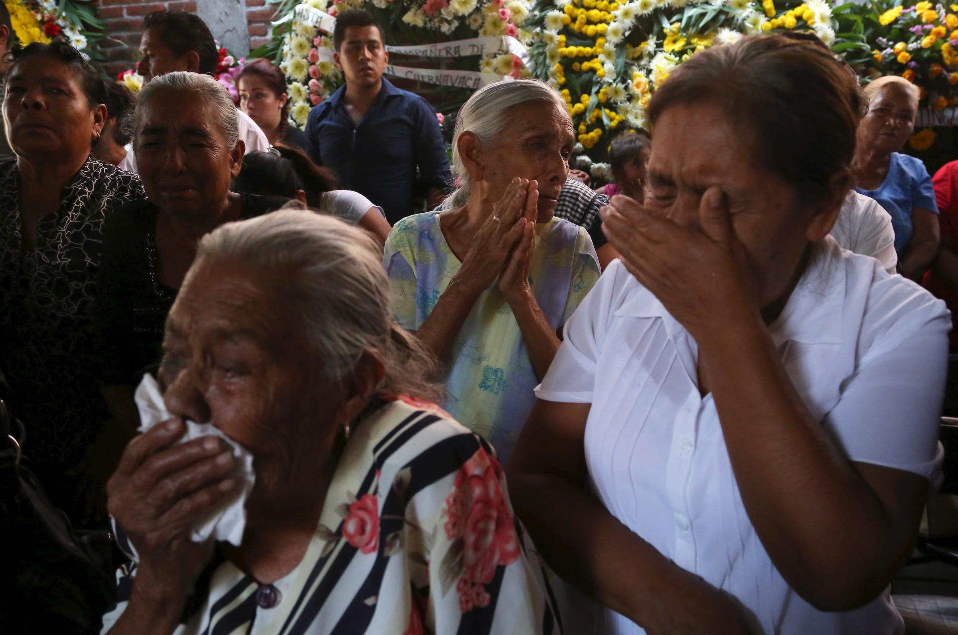 Residents react during the funeral of newly-installed Temixco mayor Gisela Mota in Temixco, south of Mexico City, after Mota was shot dead on Saturday by four armed gunmen, January 3, 2016.