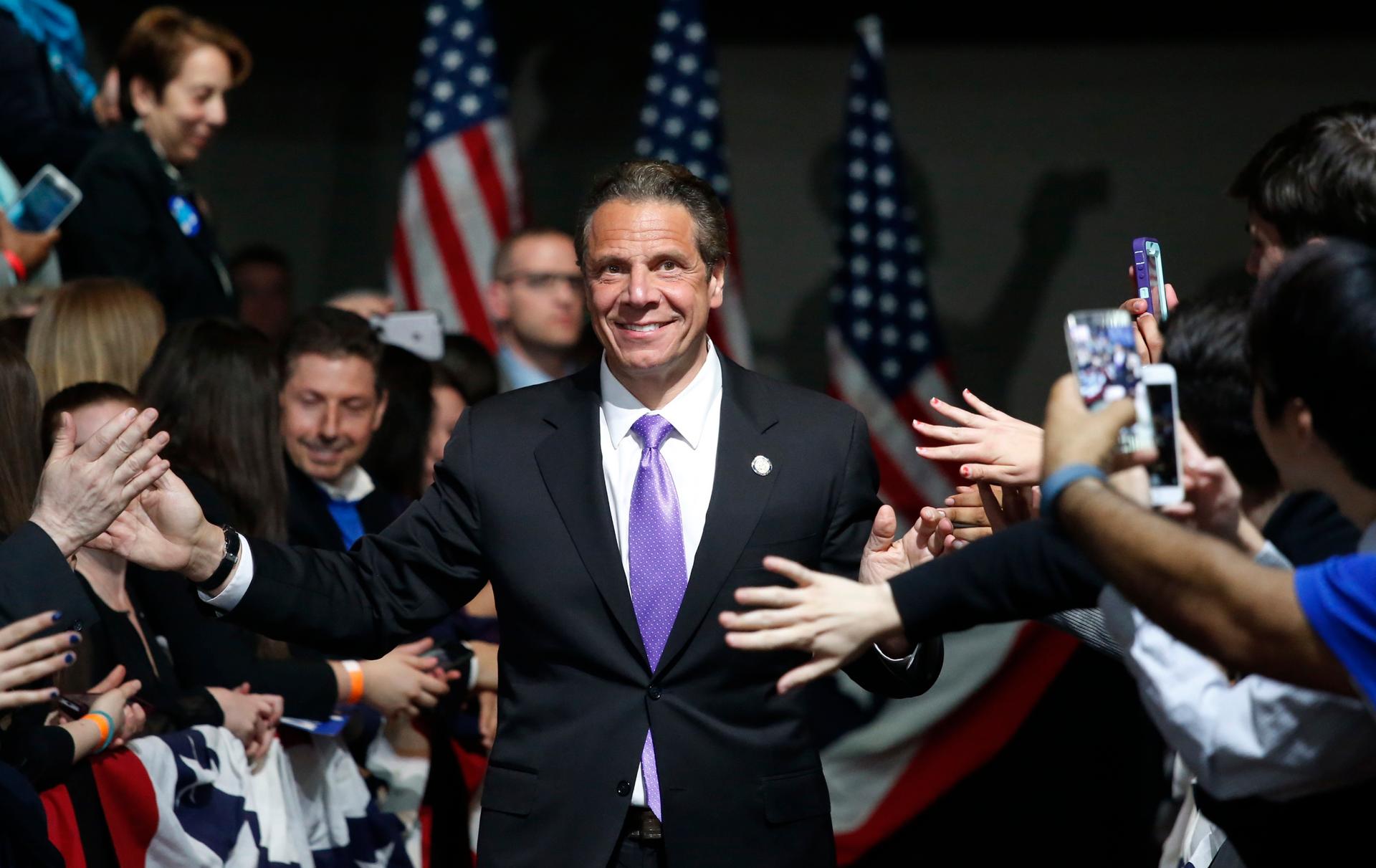 New York State Governor Andrew Cuomo enters the room before the arrival of Democratic U.S. presidential candidate Hillary Clinton at her New York presidential primary night rally in the Manhattan borough of New York City