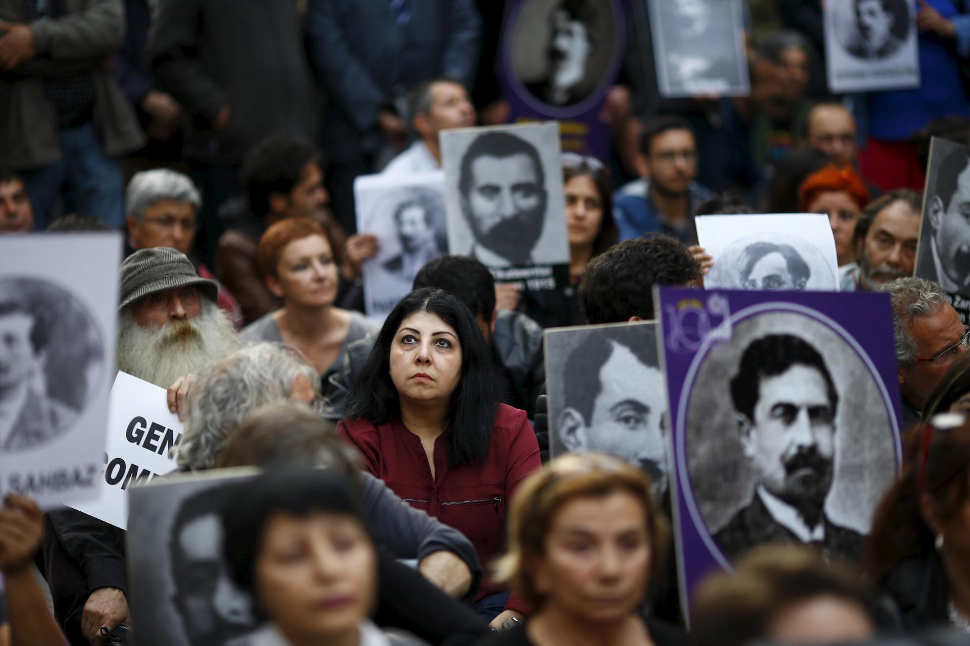 Activists hold portraits of victims during a silent demonstration on April 24 to commemorate the mass killings of Armenians by Ottoman Turks in Istanbul, Turkey.