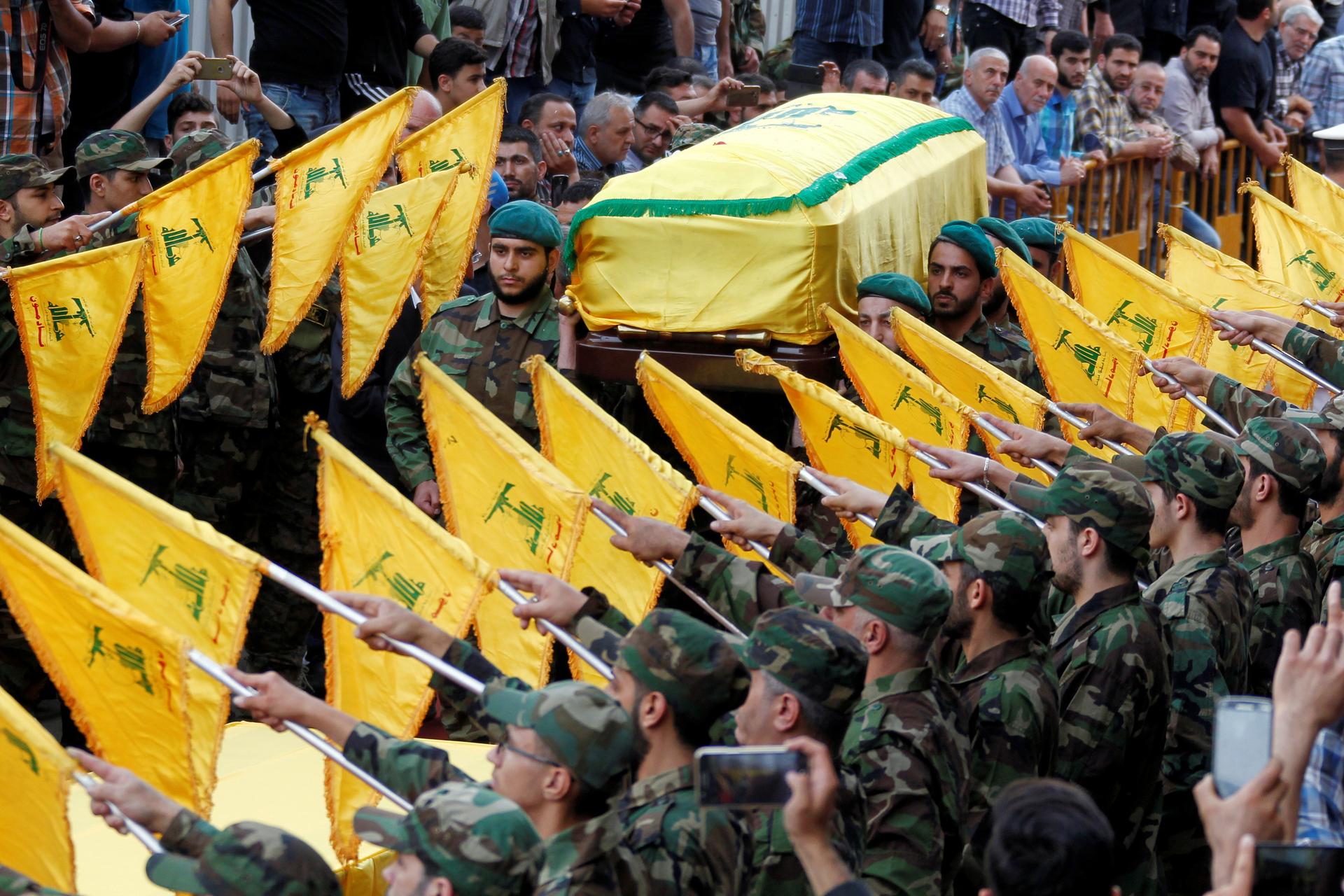Hezbollah members carry the coffin of top Hezbollah commander Mustafa Badreddine, who was killed in an attack in Syria, during his funeral in Beirut's southern suburbs, Lebanon, May 13, 2016.