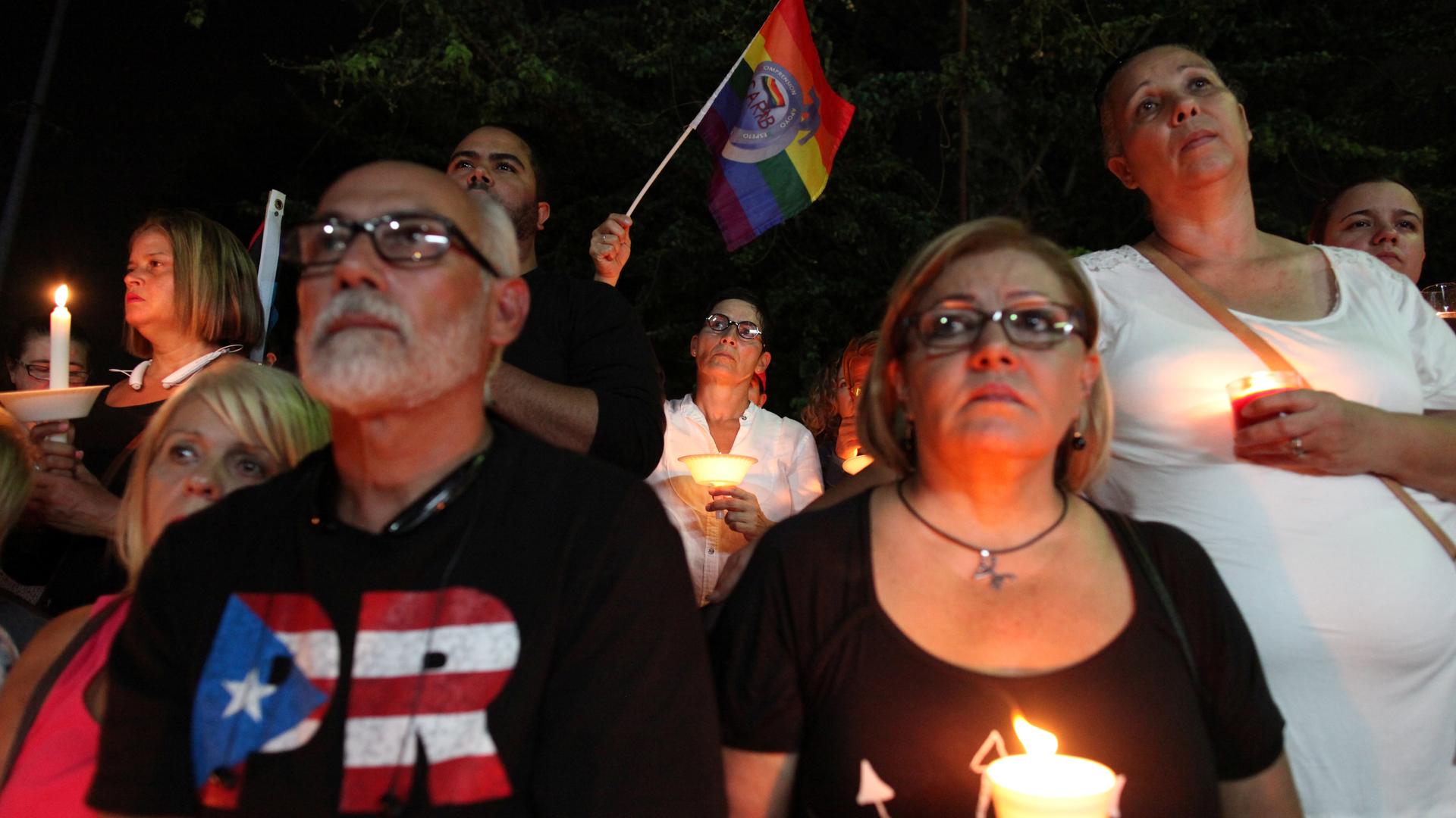 Puerto Ricans gather for a vigil in memory of the victims of the Pulse gay nightclub shooting in Orlando, in San Juan, Puerto Rico, June 14, 2016.
