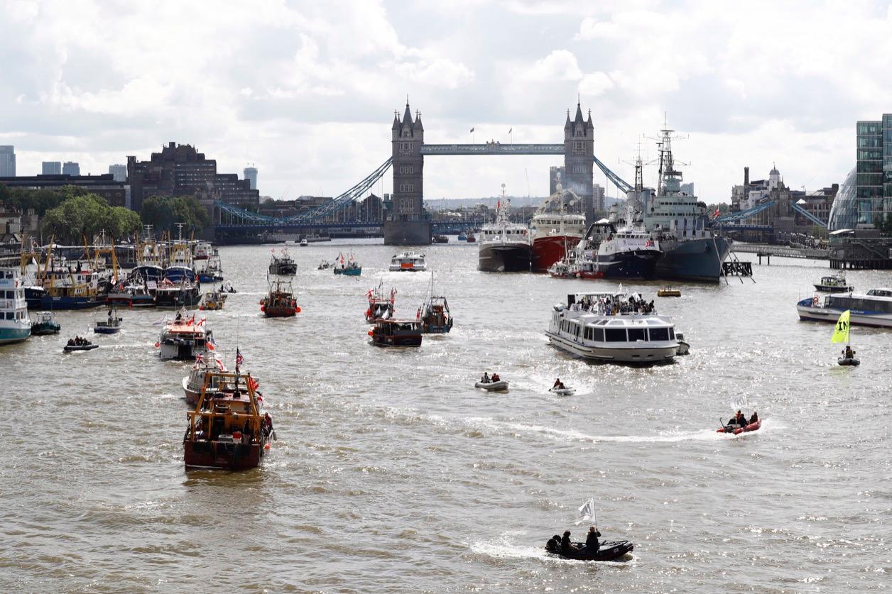 A flotilla of fishing vessels campaigning to leave the European Union sails up the river Thames in London on June 15.