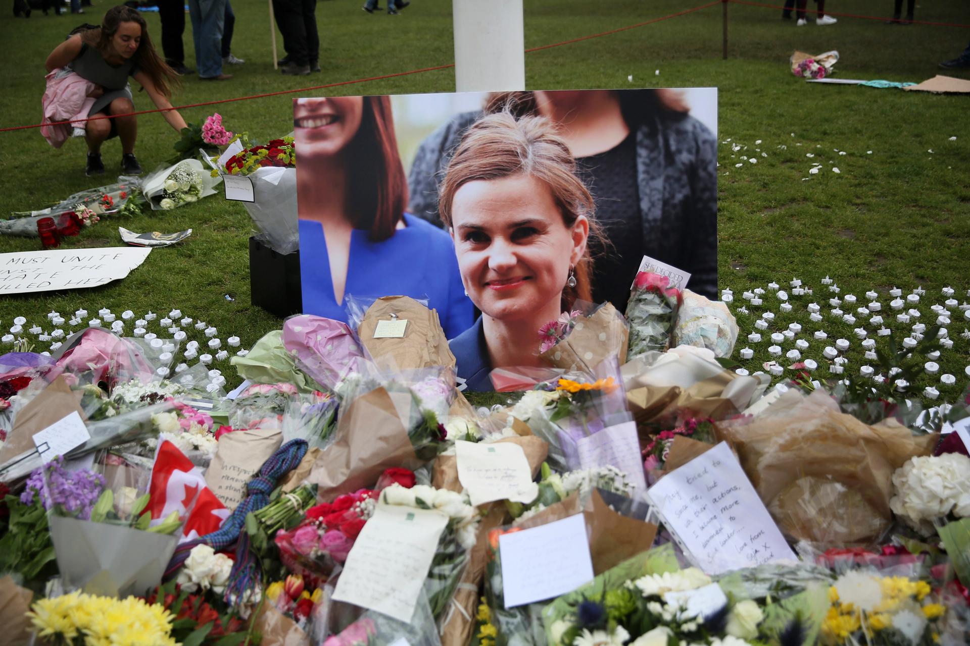 Tributes in memory of murdered Labour Party MP Jo Cox, who was shot dead in Birstall, are left at Parliament Square in London,
