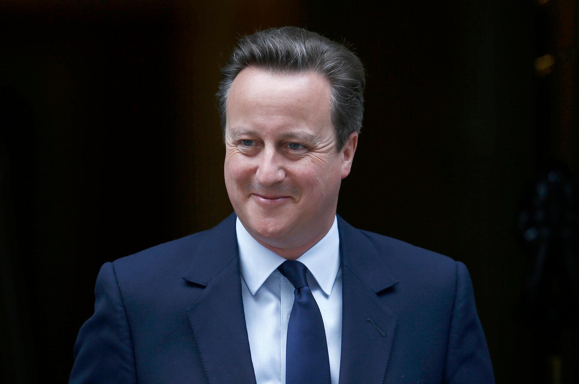 Britain's Prime Minister, David Cameron, putting on a brave face as he heads for the House of Commons, in London, Monday