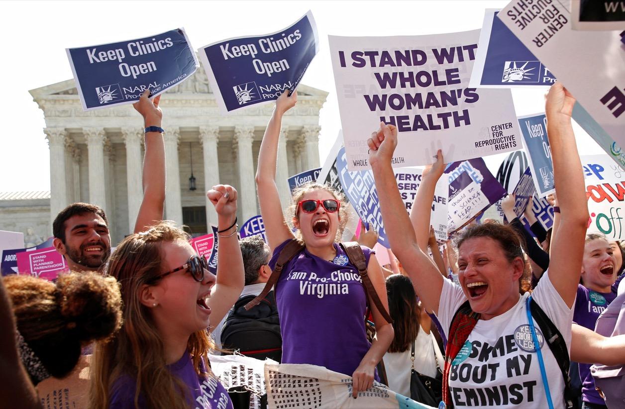 Demonstrators celebrate outside the Supreme Court Monday after it struck down a Texas law imposing strict regulations on abortion doctors and facilities that its critics contended were specifically designed to shut down clinics.
