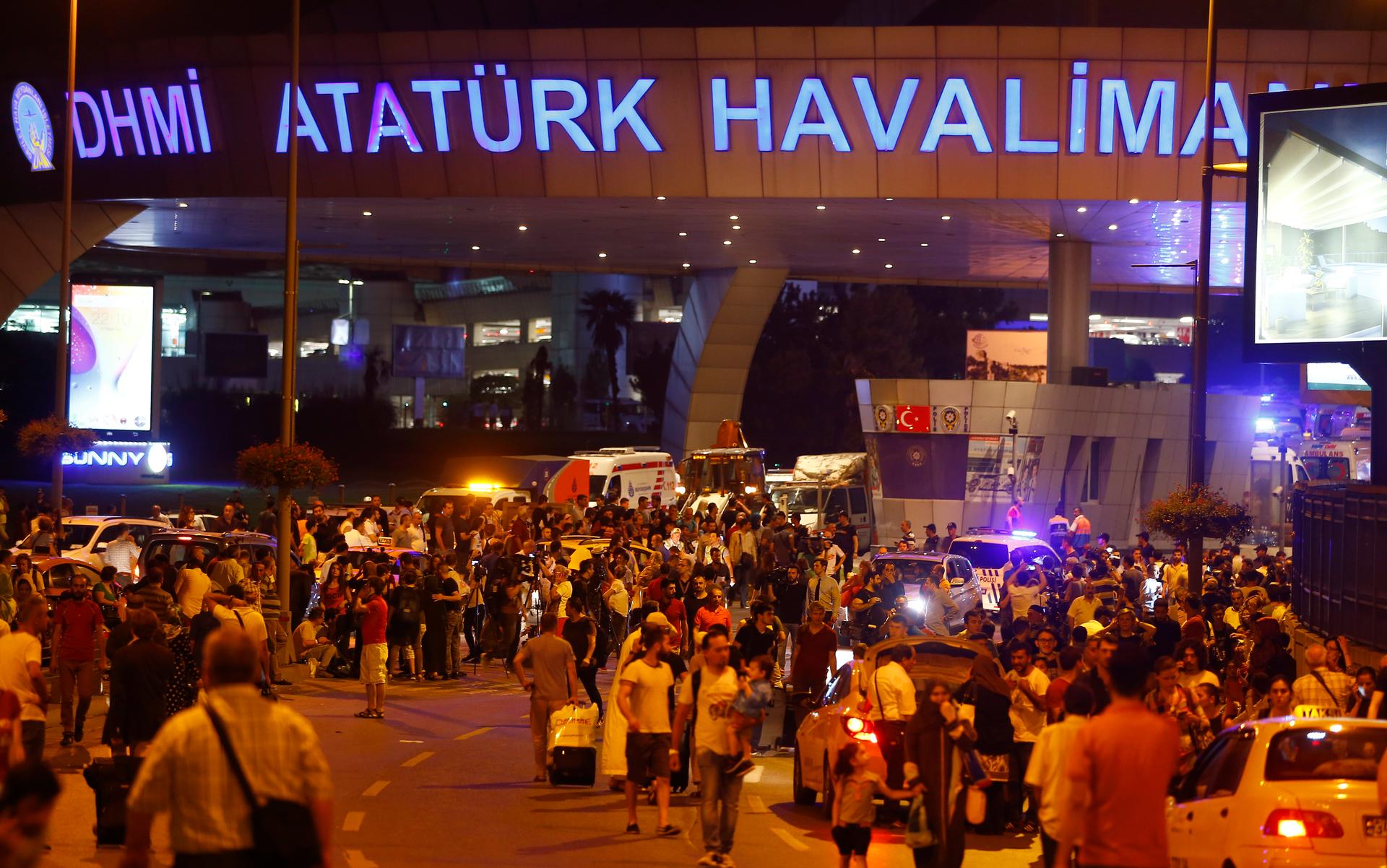 People leave Turkey's largest airport, Istanbul Ataturk, Turkey, following a blast June 28, 2016.