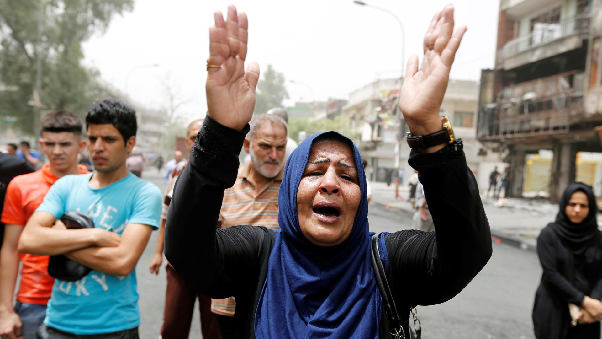A woman reacts at the site of Sunday’s suicide bomb attack in Baghdad. Residents are angry with the government’s failure to deliver promised security.