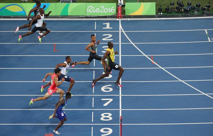 2016 Rio Olympics - Athletics - Final - Men's 100m Semifinal - Olympic Stadium - Rio de Janeiro, Brazil - 14/08/2016. Usain Bolt (JAM) of Jamaica crosses the finish line. 