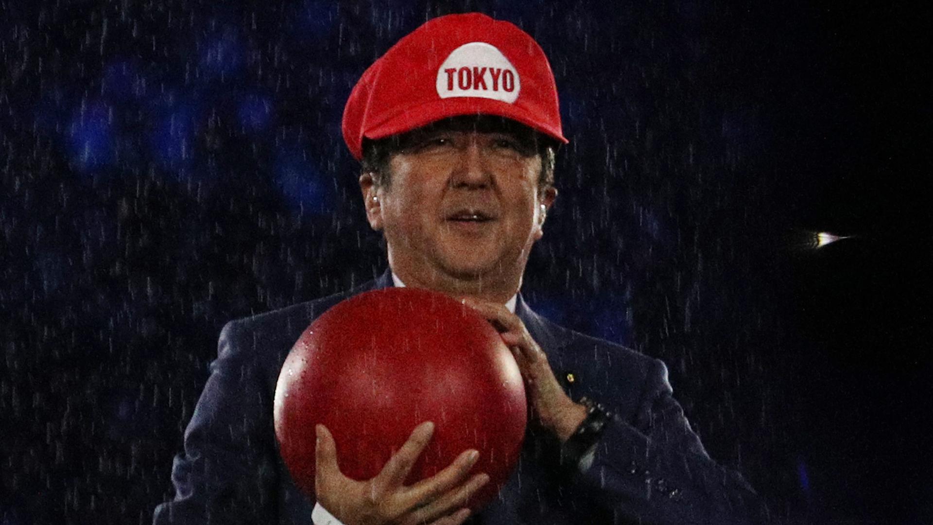 Prime Minister of Japan Shinzo Abe is seen on stage dressed as Super Mario.