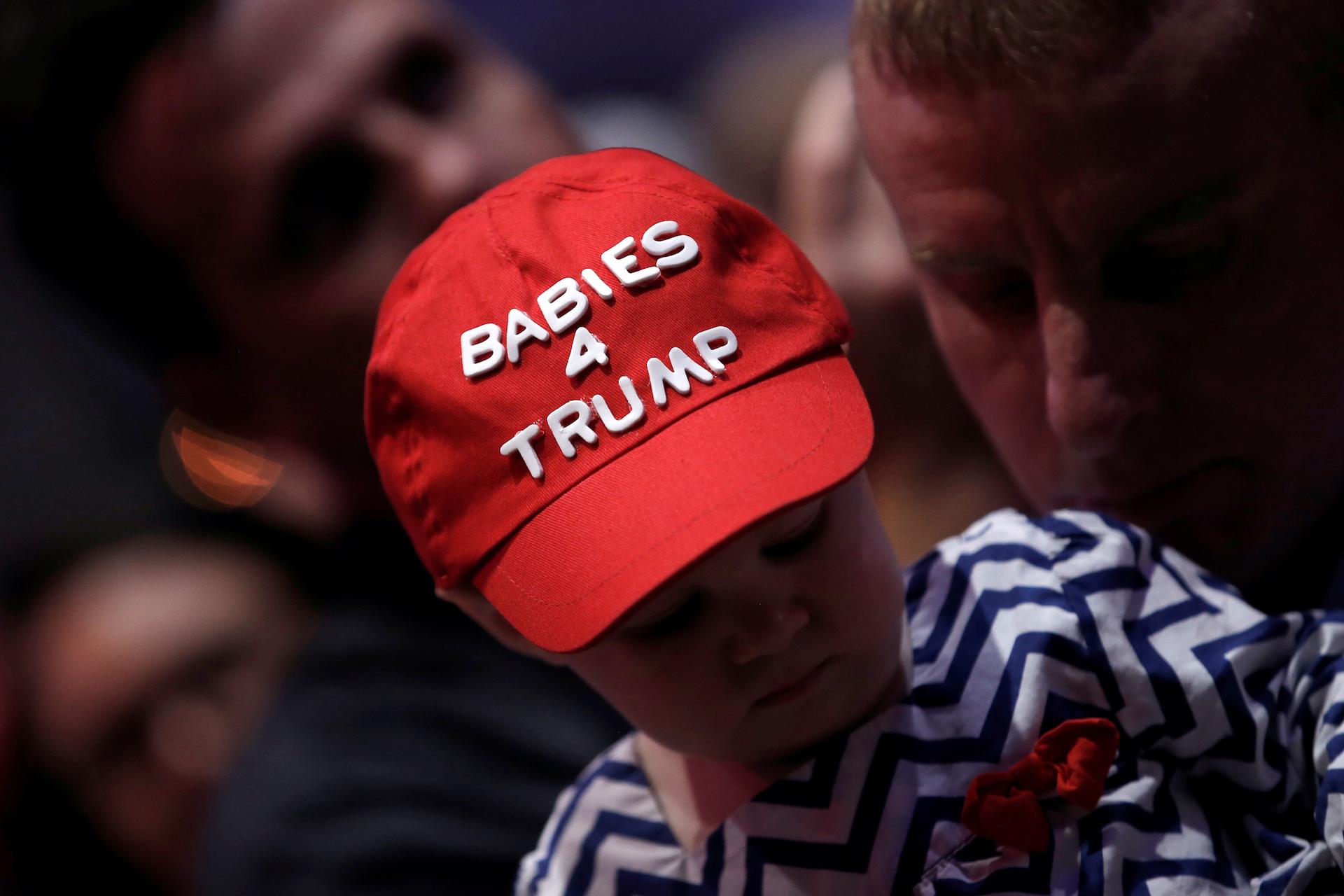 A small child wears a "Babies 4 Trump" cap as the then-candidate Donald Trump spoke at a rally in Greenville, North Carolina, on Sept. 6, 2016.