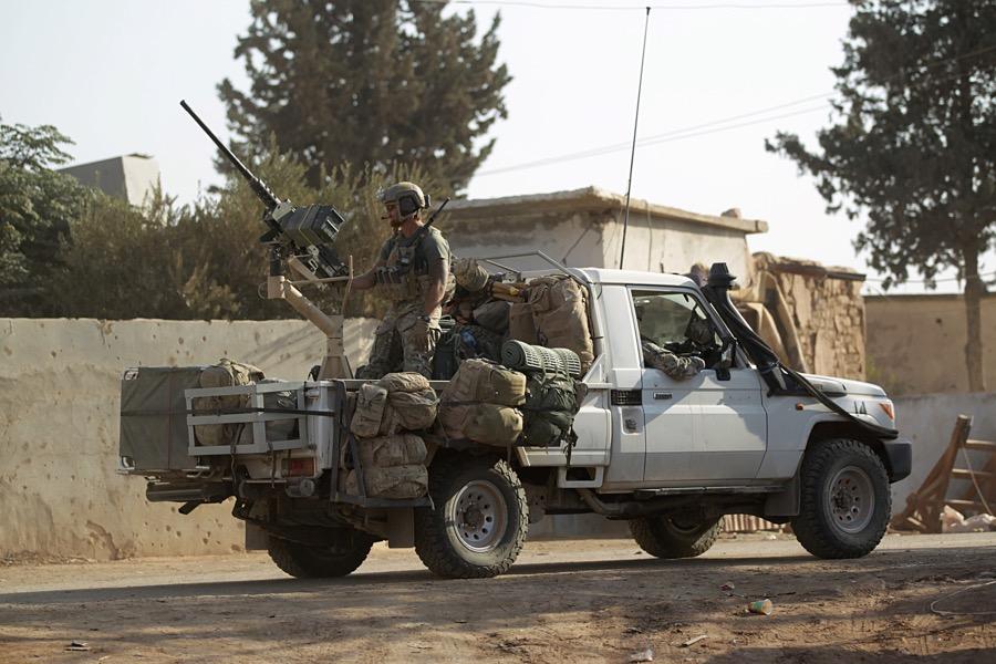 US soldiers ride a military vehicle in al-Kherbeh village, northern Aleppo province, Syria on Oct. 24.