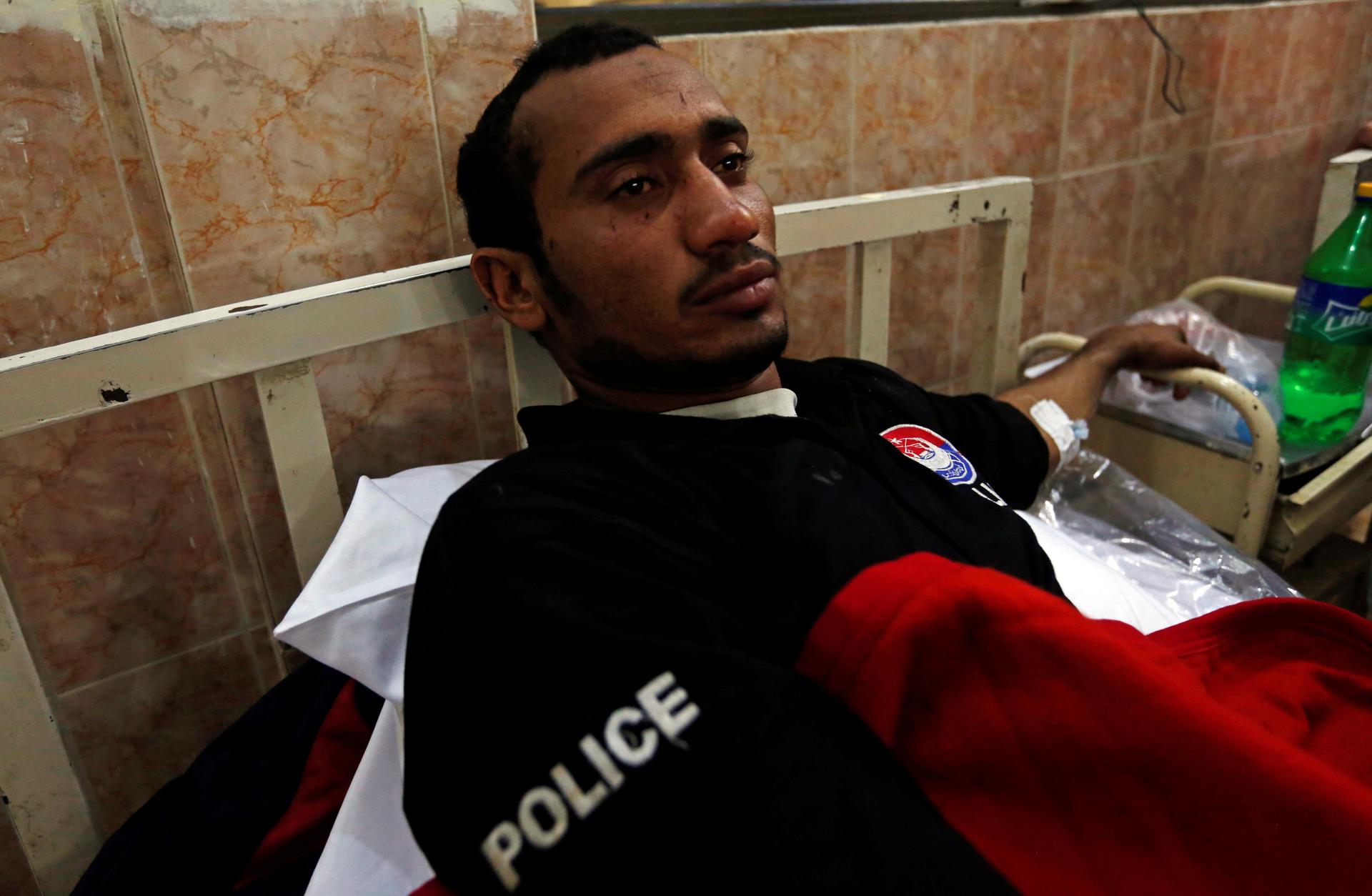 A police cadet injured during the attack on the Police Training Center lies in bed in a hospital in Quetta, Pakistan.