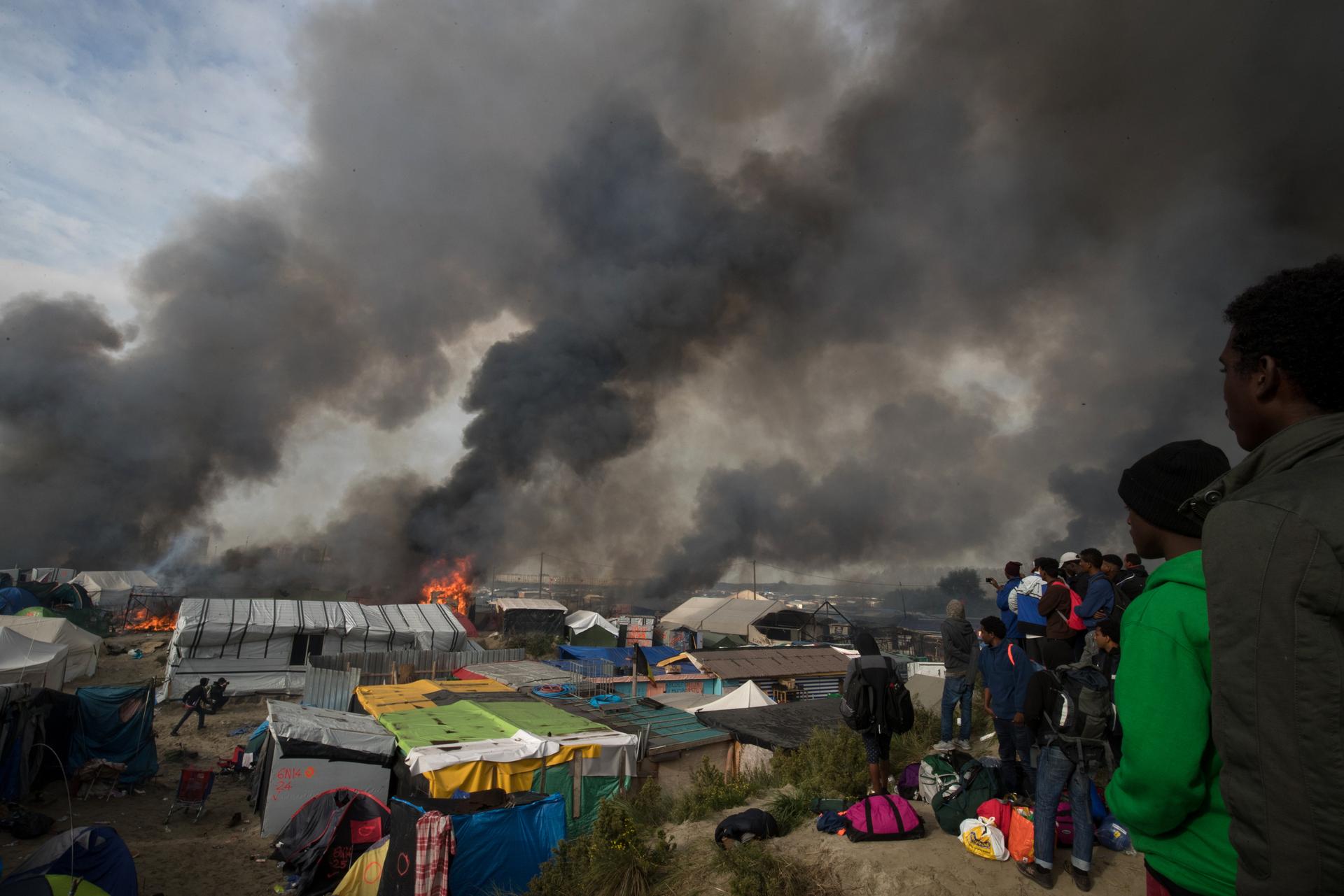 Fires broke out in many parts of the camp as the authorities attempted to clear it of residents.