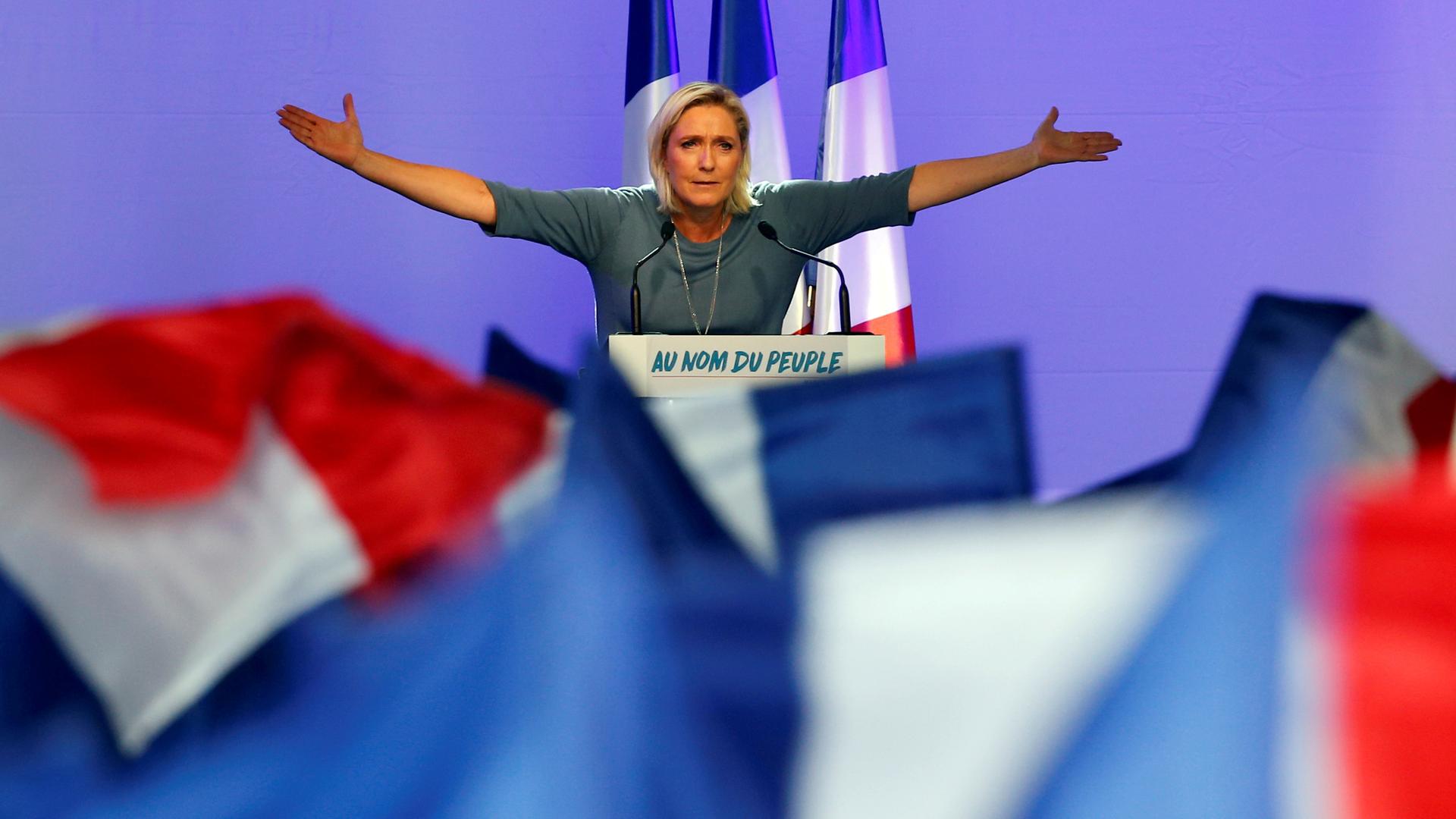 Marine Le Pen, French National Front leader, gestures during a rally