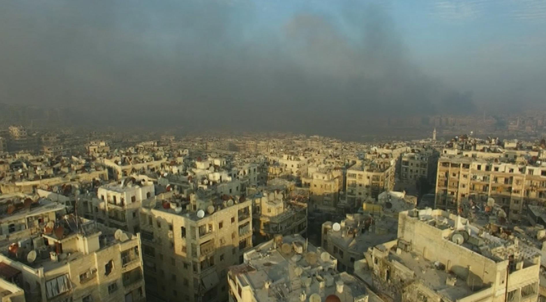Smoke rising over bomb-damaged eastern Aleppo, Syria, on Dec. 12, 2016.