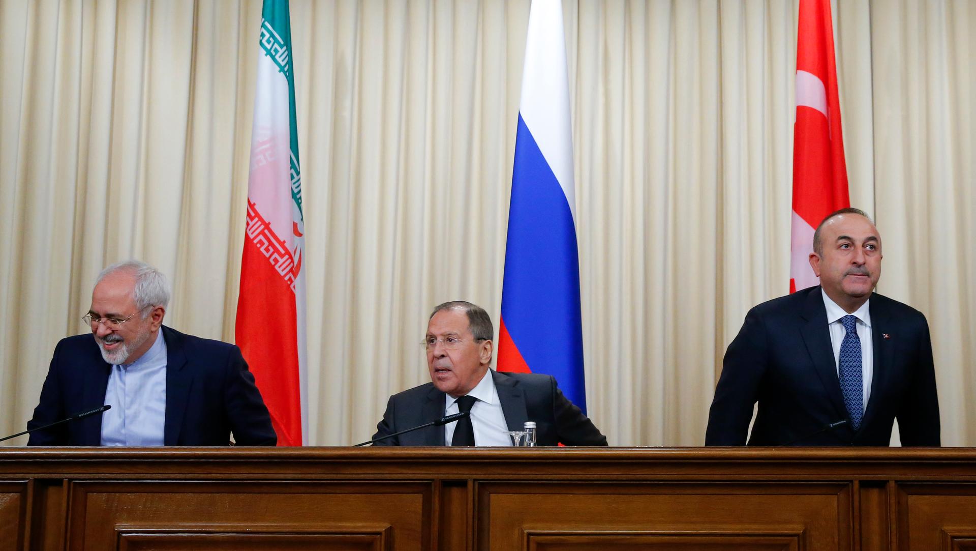 Foreign ministers, Sergei Lavrov (C) of Russia, Mevlut Cavusoglu (R) of Turkey and Mohammad Javad Zarif of Iran, prepare for a news conference in Moscow, December 20th 2016. 