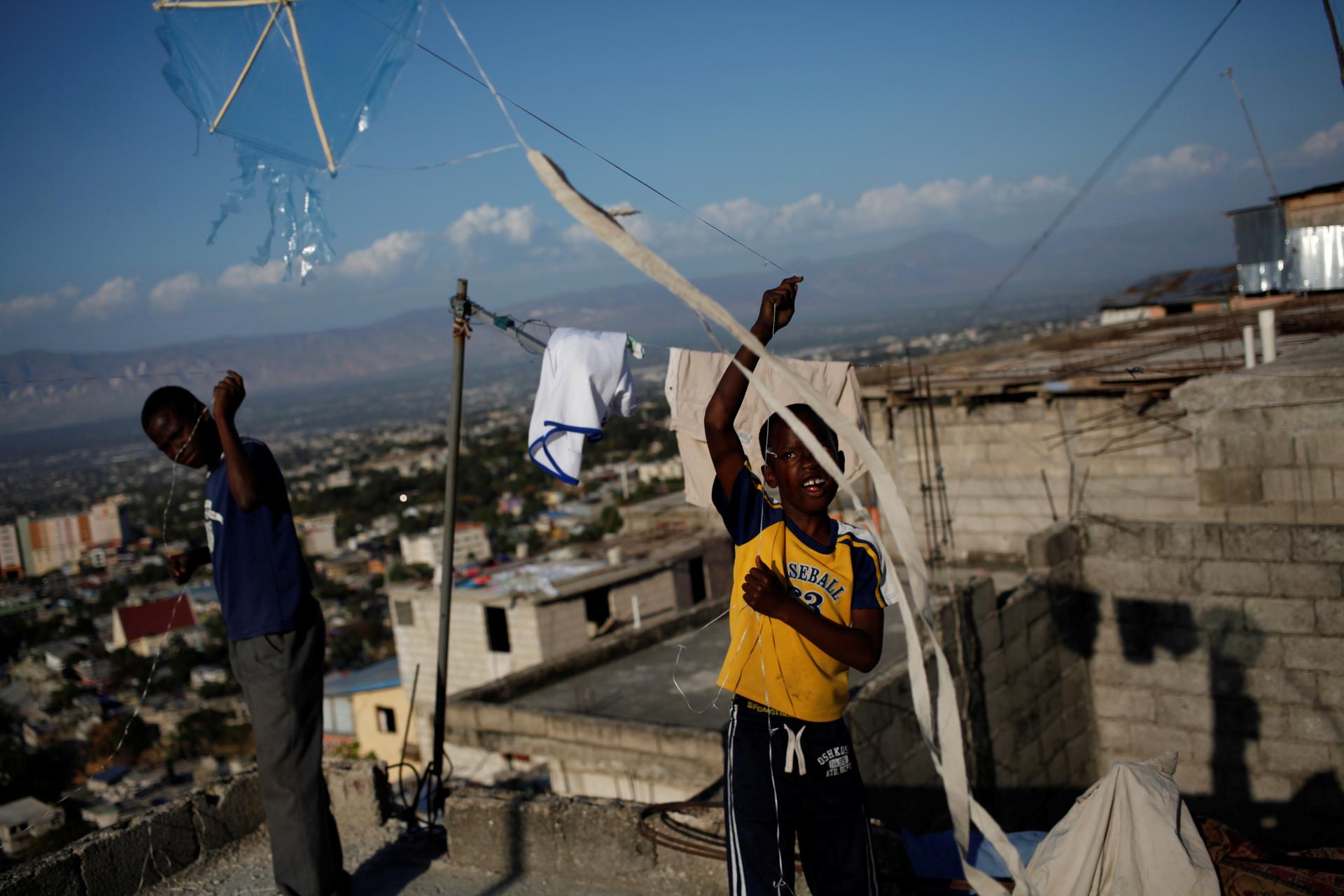Children fly kites in a neighborhood of Port-au-Prince, Haiti, February 8, 2017.