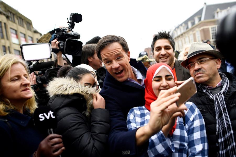 Dutch Prime Minister Mark Rutte greets supporters during campaigning in The Hague, Netherlands on March 14.