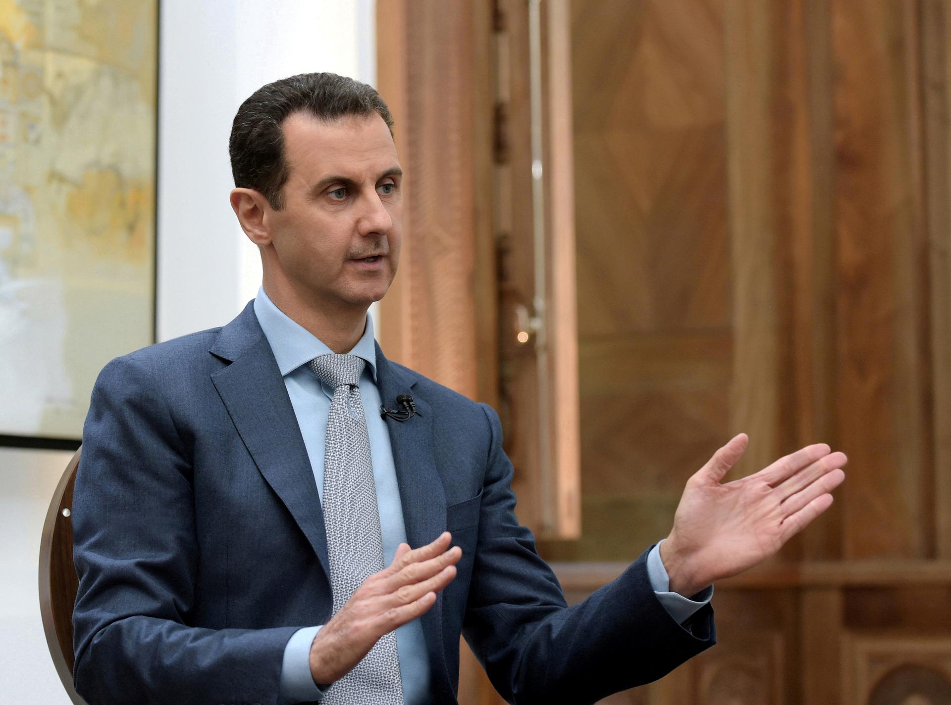 Syria's President Bashar al-Assad speaks during an interview with Yahoo News in this handout picture provided by SANA on February 10, 2017, Syria.