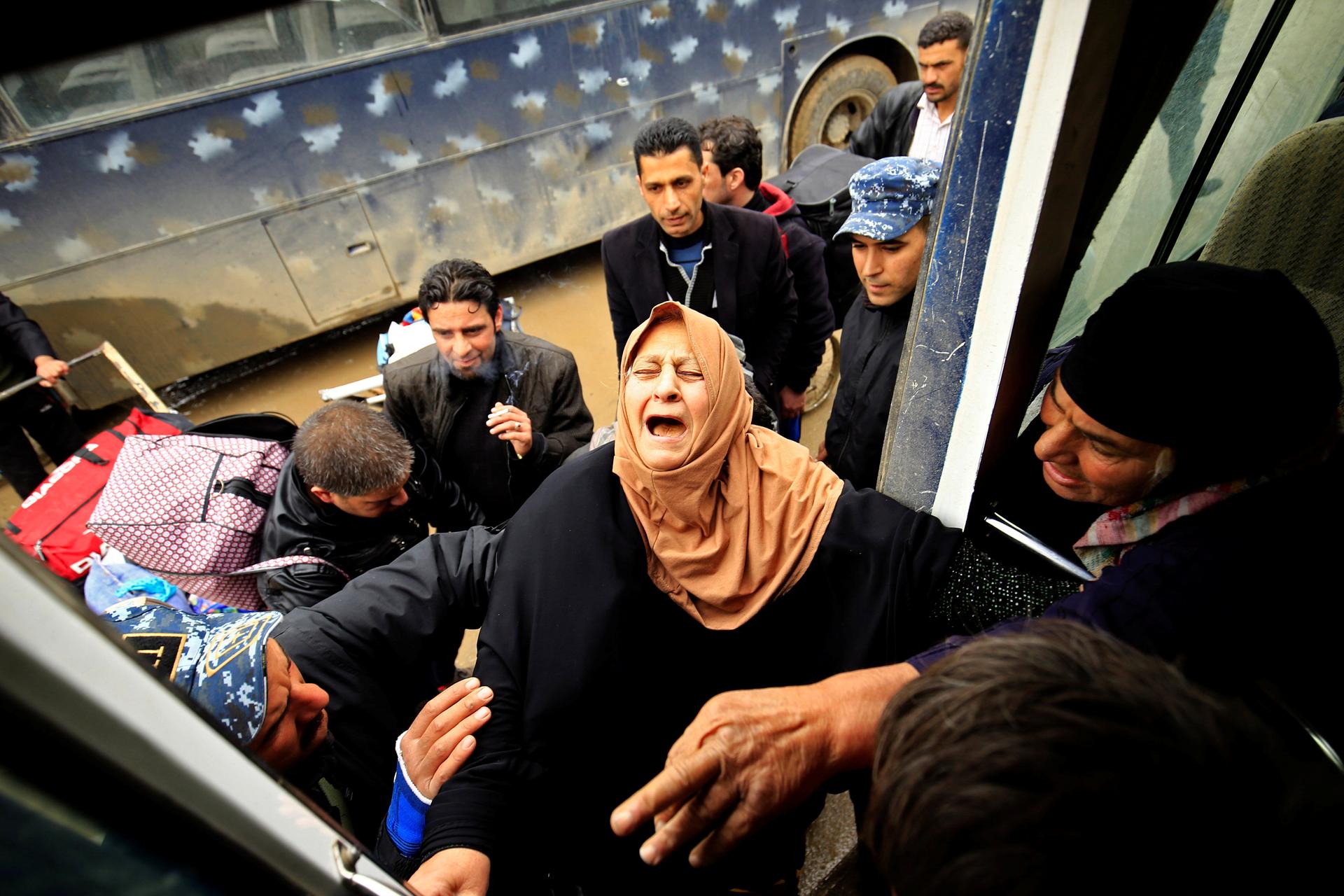 A displaced Iraqi woman, who fled from clashes between Iraqi forces and Islamic State militants, in Mosul, Iraq