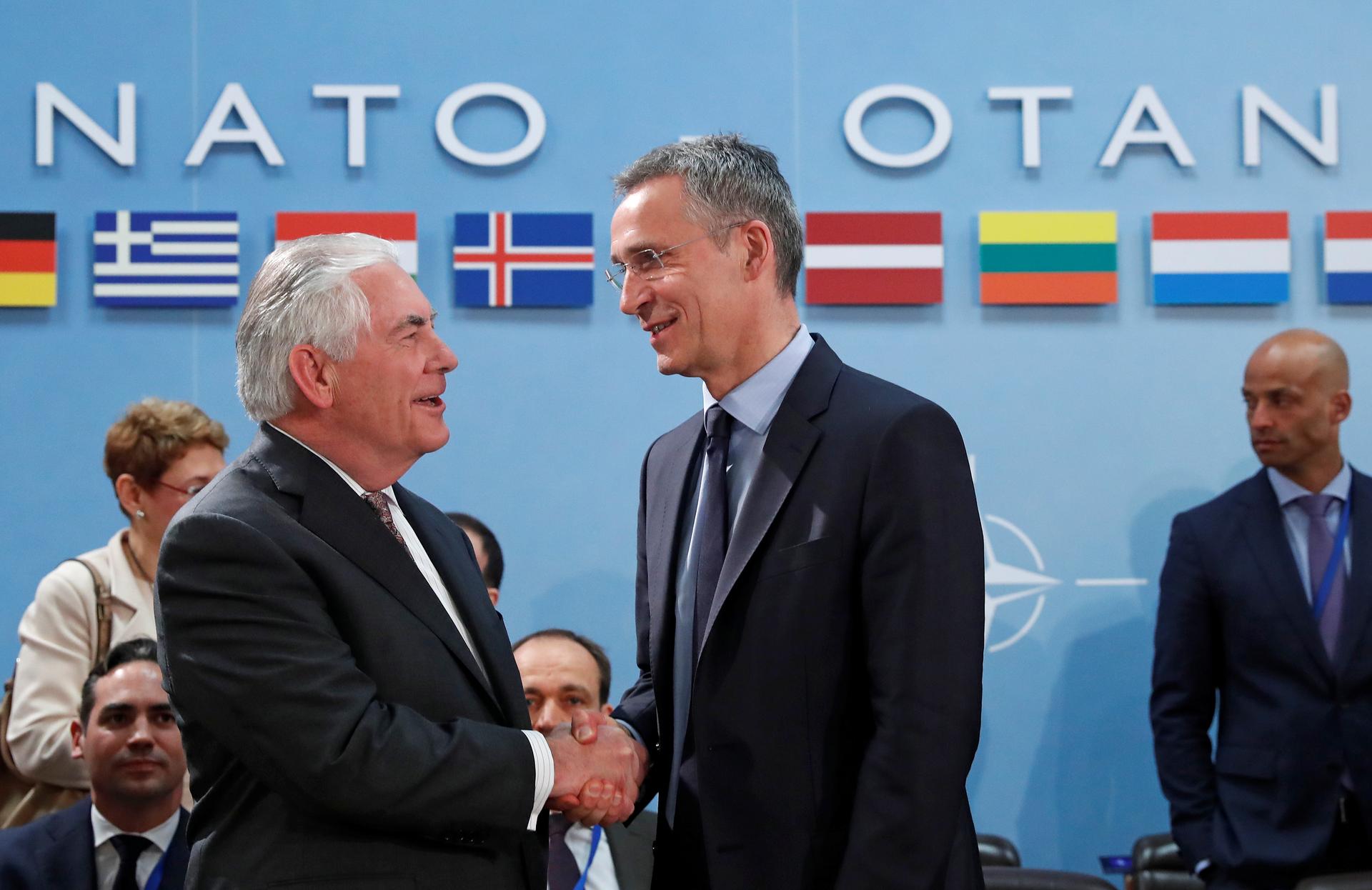 U.S. Secretary of State Rex Tillerson (L) shakes hands with NATO Secretary General Jens Stoltenberg during a NATO foreign ministers meeting at the Alliance's headquarters in Brussels.