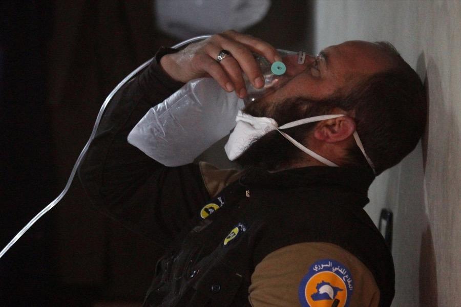 A civil defense member breathes through an oxygen mask, after what rescue workers described as a suspected gas attack in the town of Khan Sheikhoun in rebel-held Idlib, Syria on April 4.