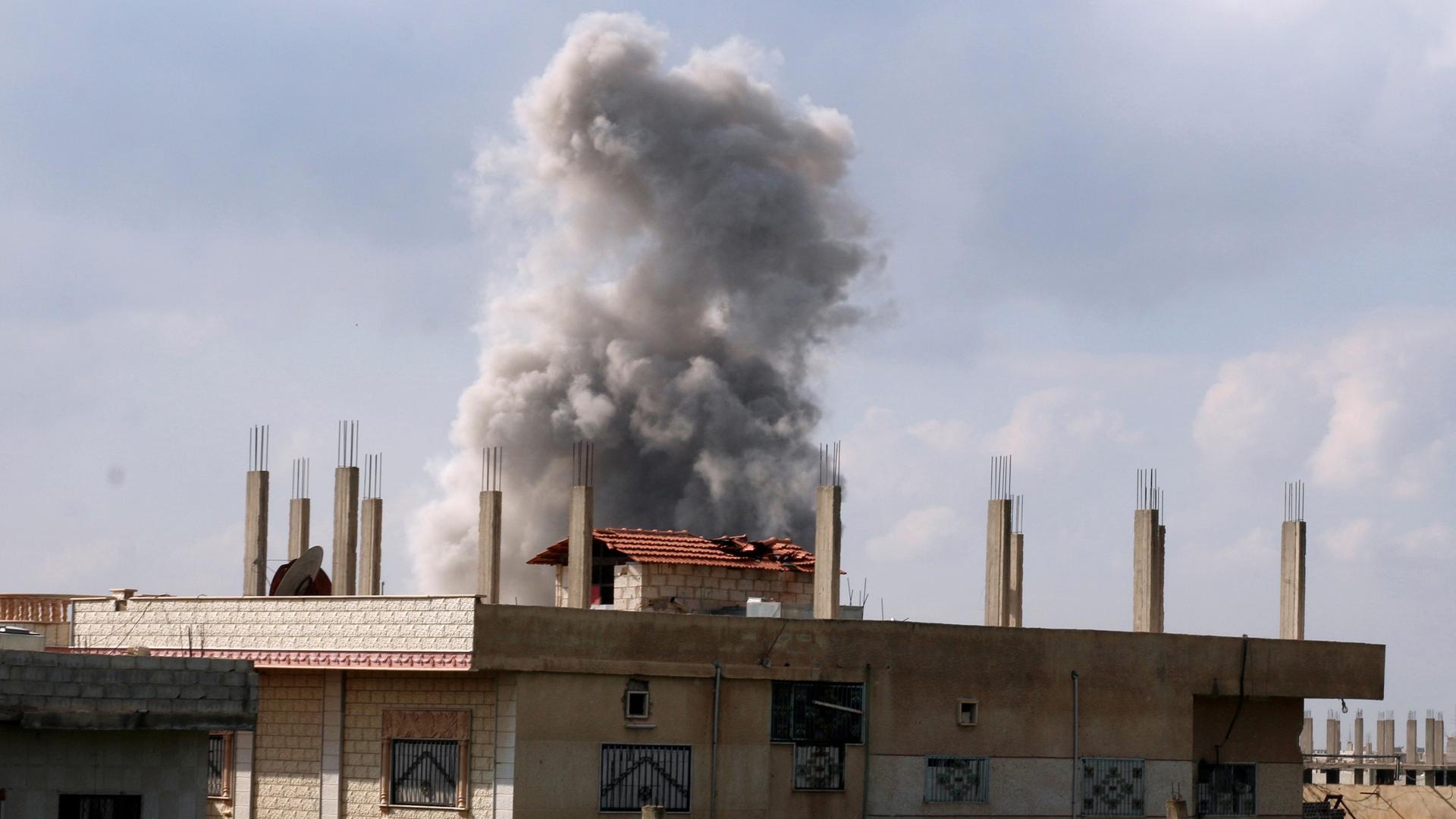Smoke rises after an airstrike on a rebel-held area, April 7th 2017