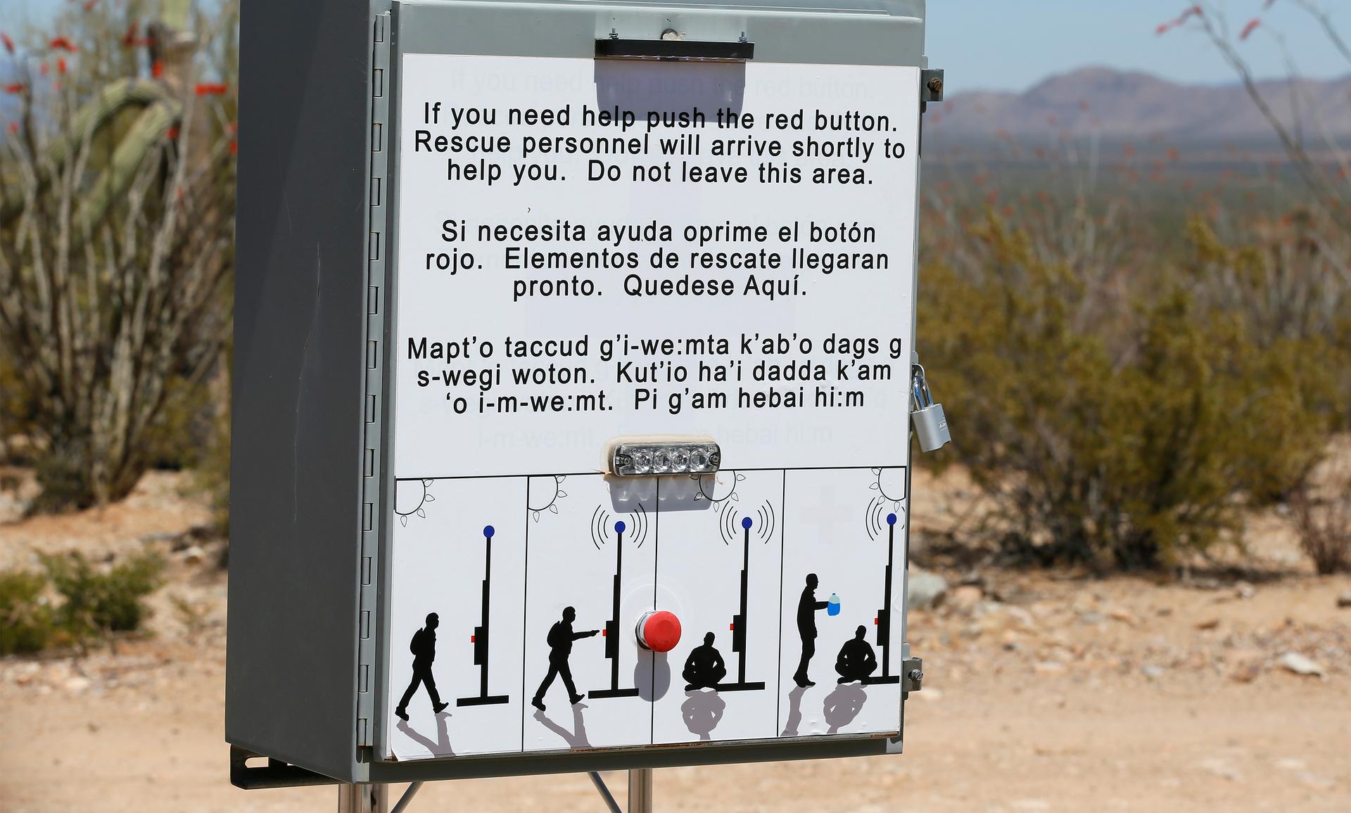 Sign box at border with button to press for help