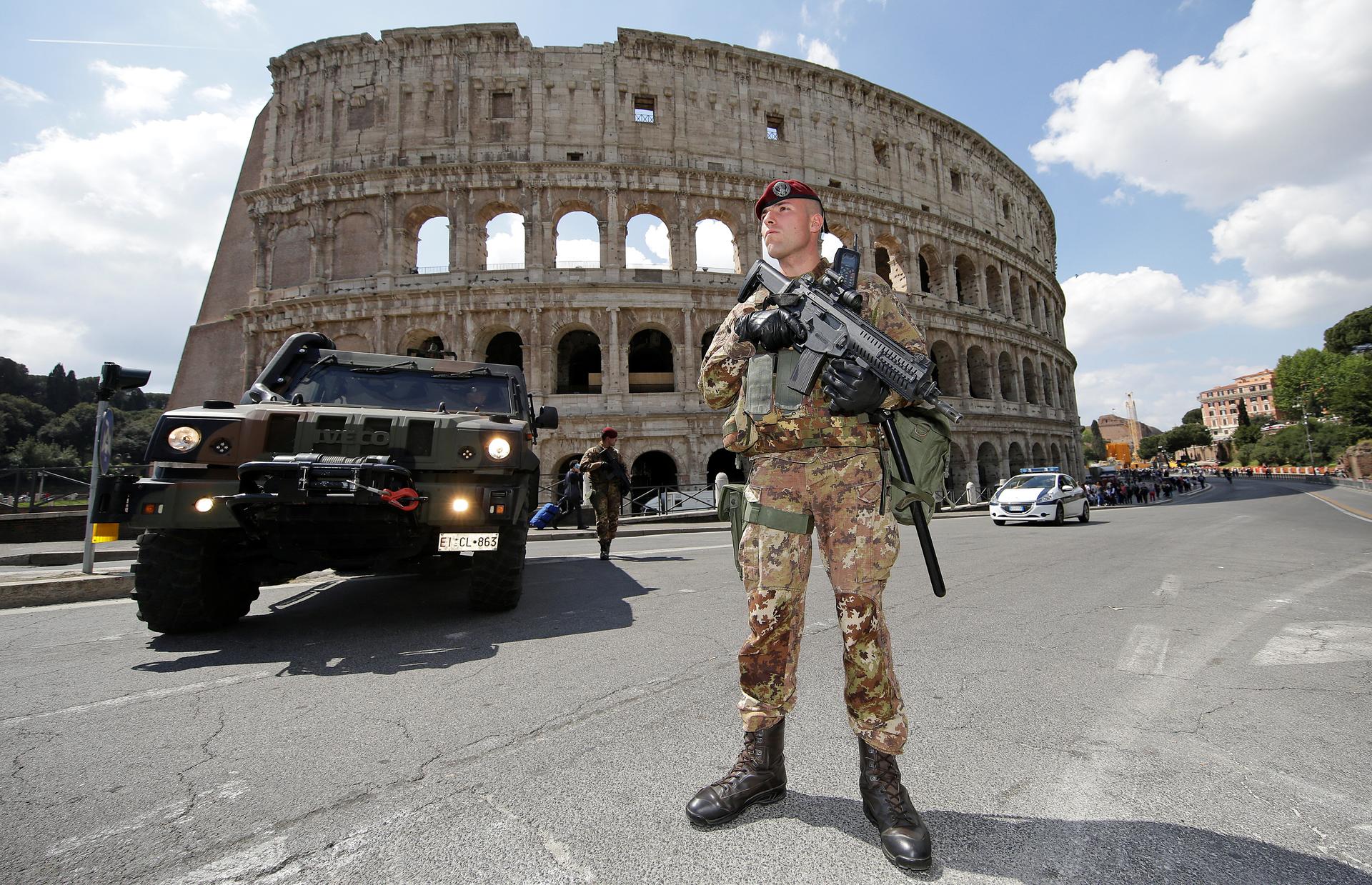 a soldier in front of the colloseum