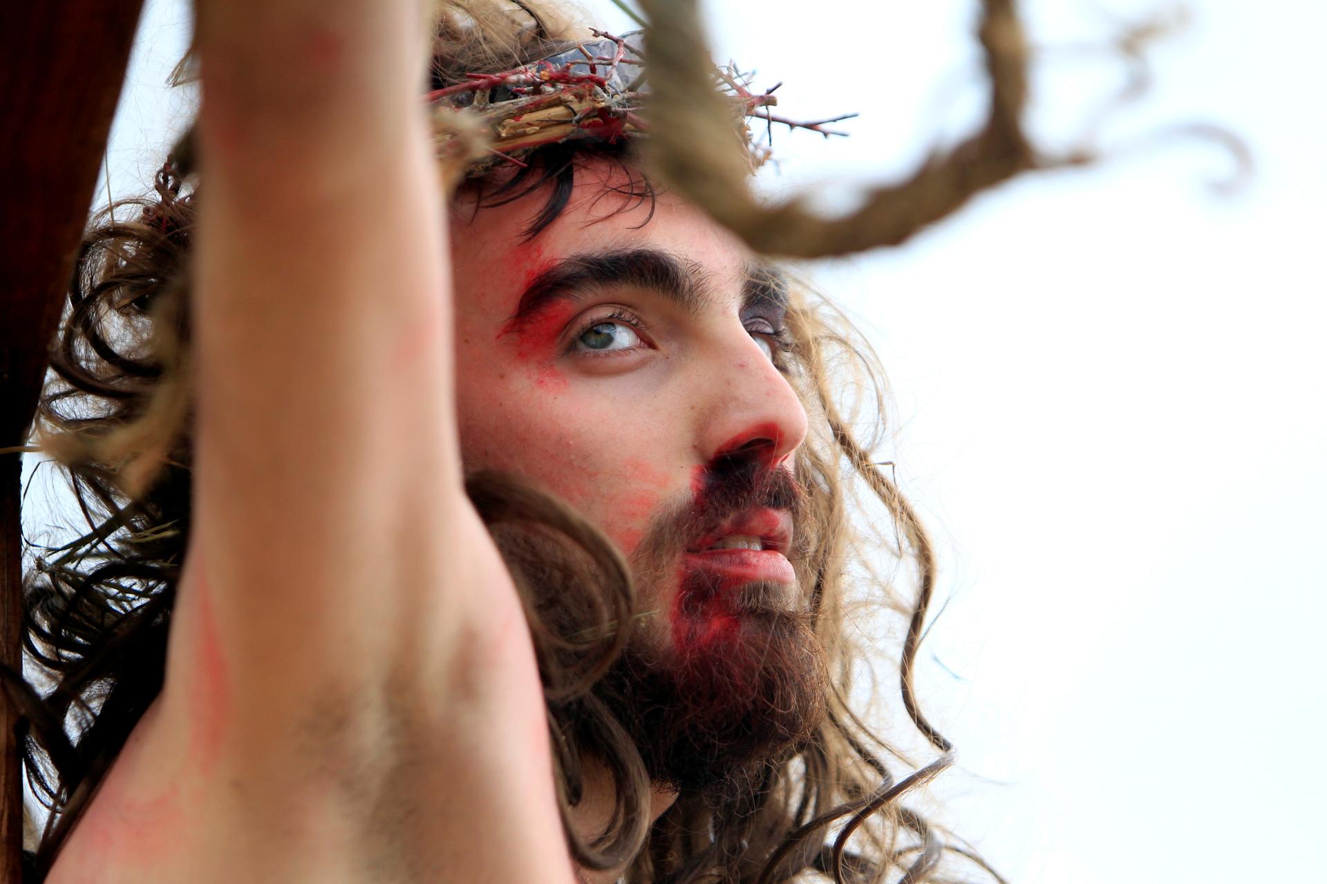 A Christian man, portraying Jesus Christ, is hung on a cross during a re-enactment of the crucifixion of Jesus Christ on Good Friday in al-Qraya village, in southern Lebanon on April 14, 2017. Muslims also revere Jesus as a prophet. In the Quran, the stor