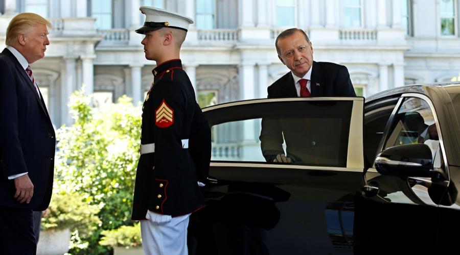 President Donald Trump watches as Turkey's President Recep Tayyip Erdogan departs at the entrance to the West Wing of the White House in Washington on May 16.