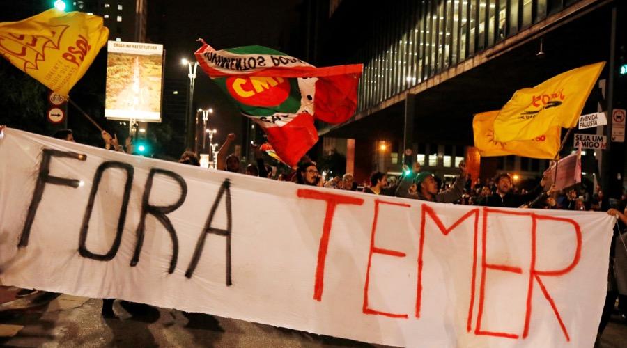 Demonstrators protest against Brazil's President Michel Temer in Sao Paulo, Brazil, May 17. The banner reads: "Out Temer."