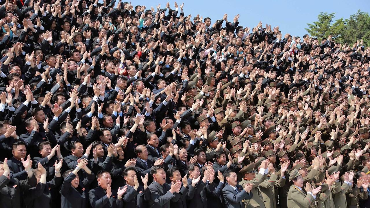 North Korean nuclear scientists cheer leader Kim Jong Un