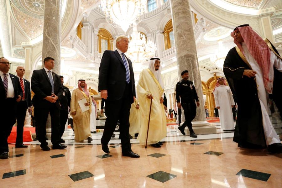 President Donald Trump walks with Saudi Arabia's King Salman bin Abdulaziz Al Saud