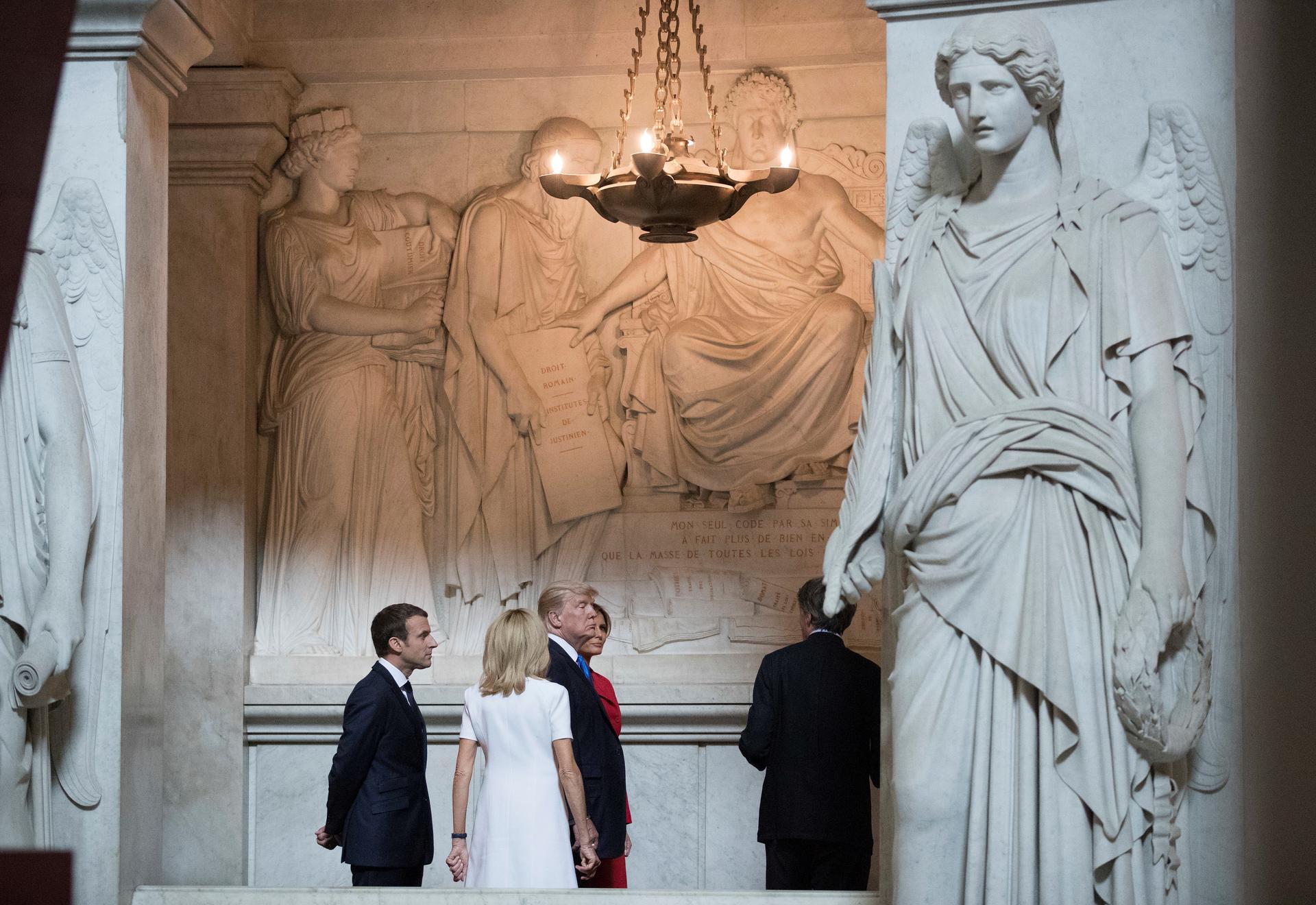 U.S. President Donald Trump and First Lady Melania Trump, French President Emmanuel Macron, and his wife Brigitte Macron tour Napoleon Bonaparte’s Tomb at Les Invalides in Paris, France, July 13, 2017. 