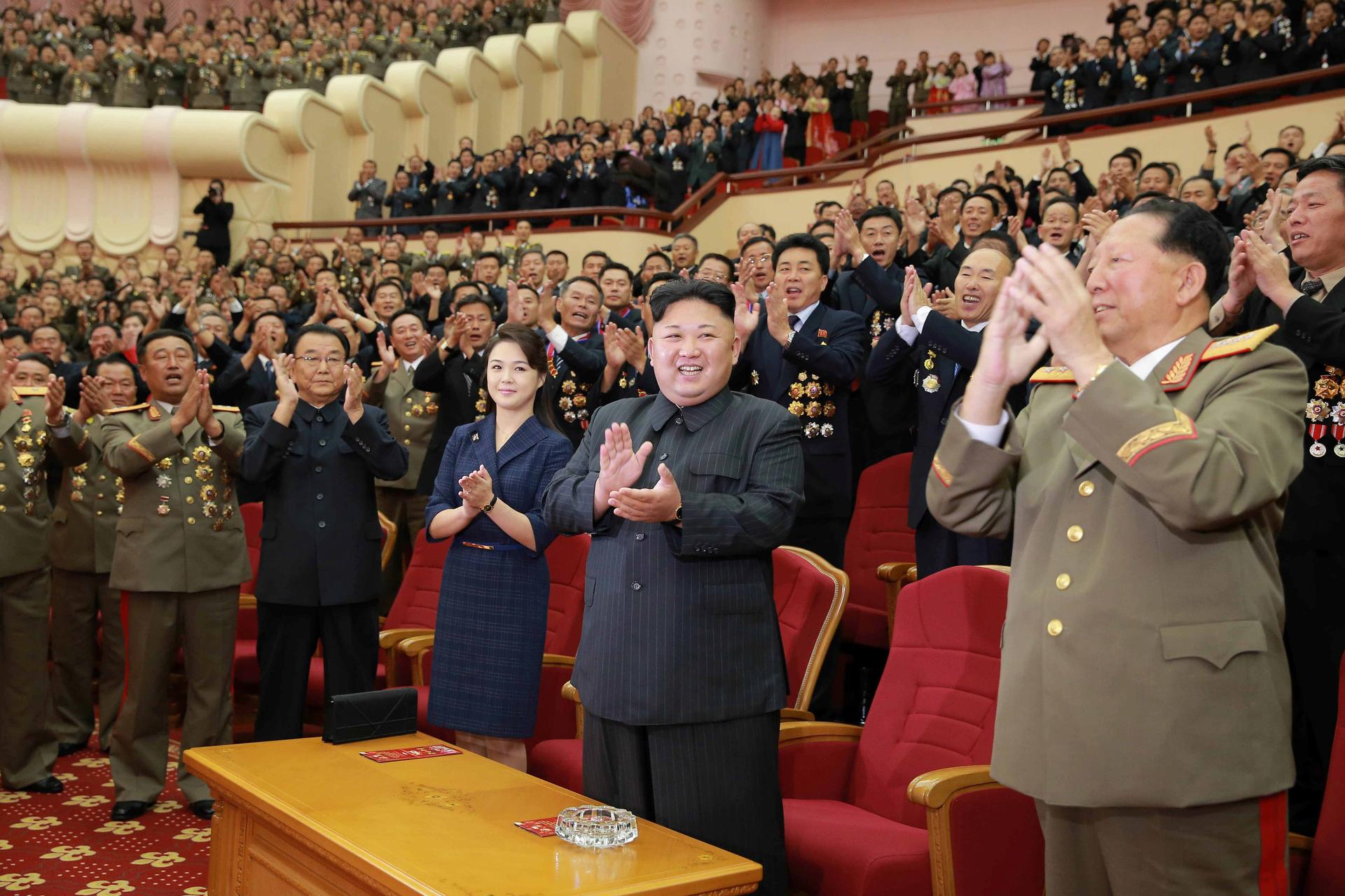 North Korean leader Kim Jong-un claps during a celebration for nuclear scientists and engineers who contributed to a hydrogen bomb test, in this undated photo released by North Korea's Korean Central News Agency (KCNA) in Pyongyang on September 10, 2017.