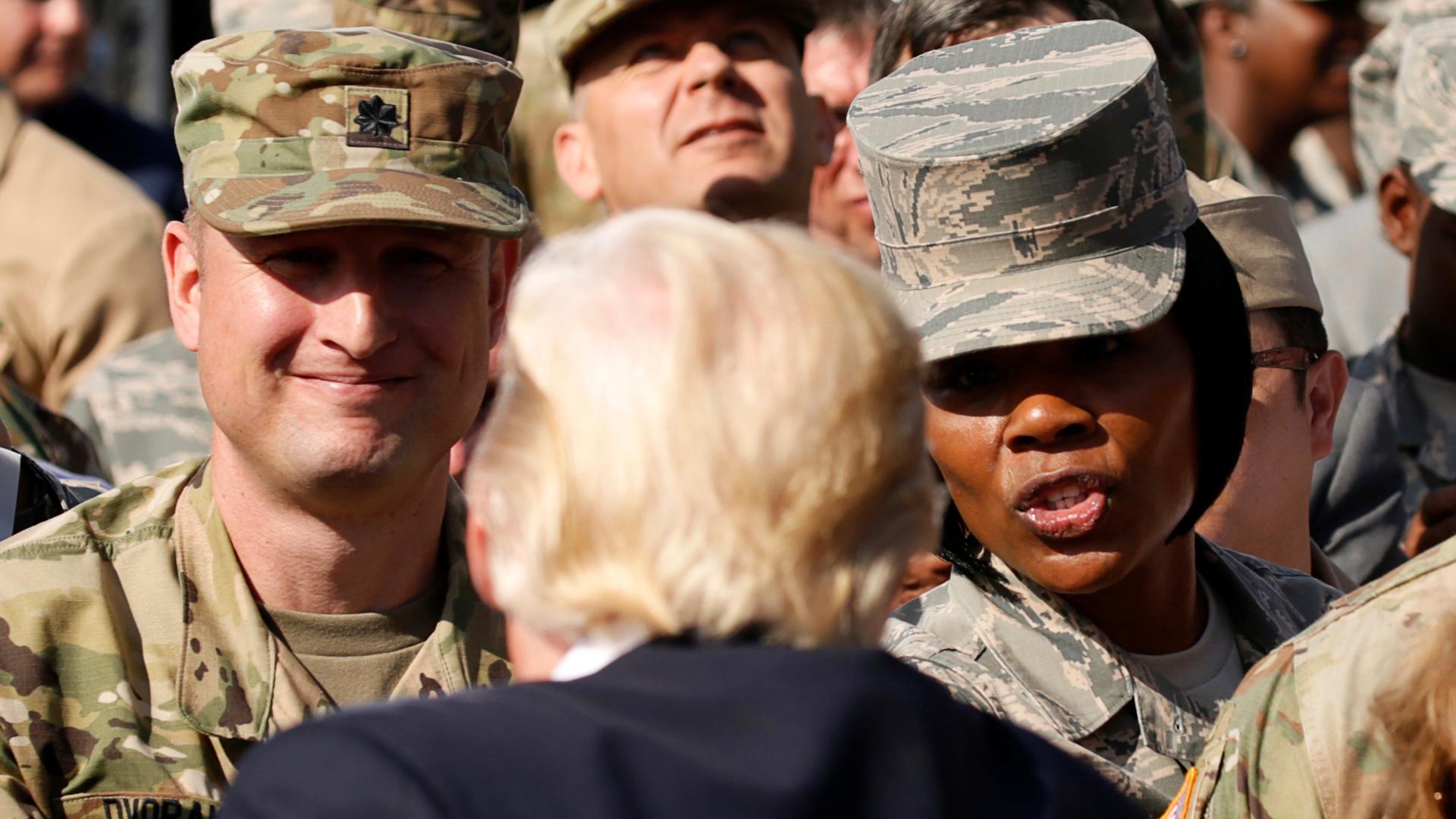 U.S. President Donald Trump greets military personnel while attending the 9/11 observance at the National 9/11 Pentagon Memorial in Arlington, Virginia on September 11, 2017.