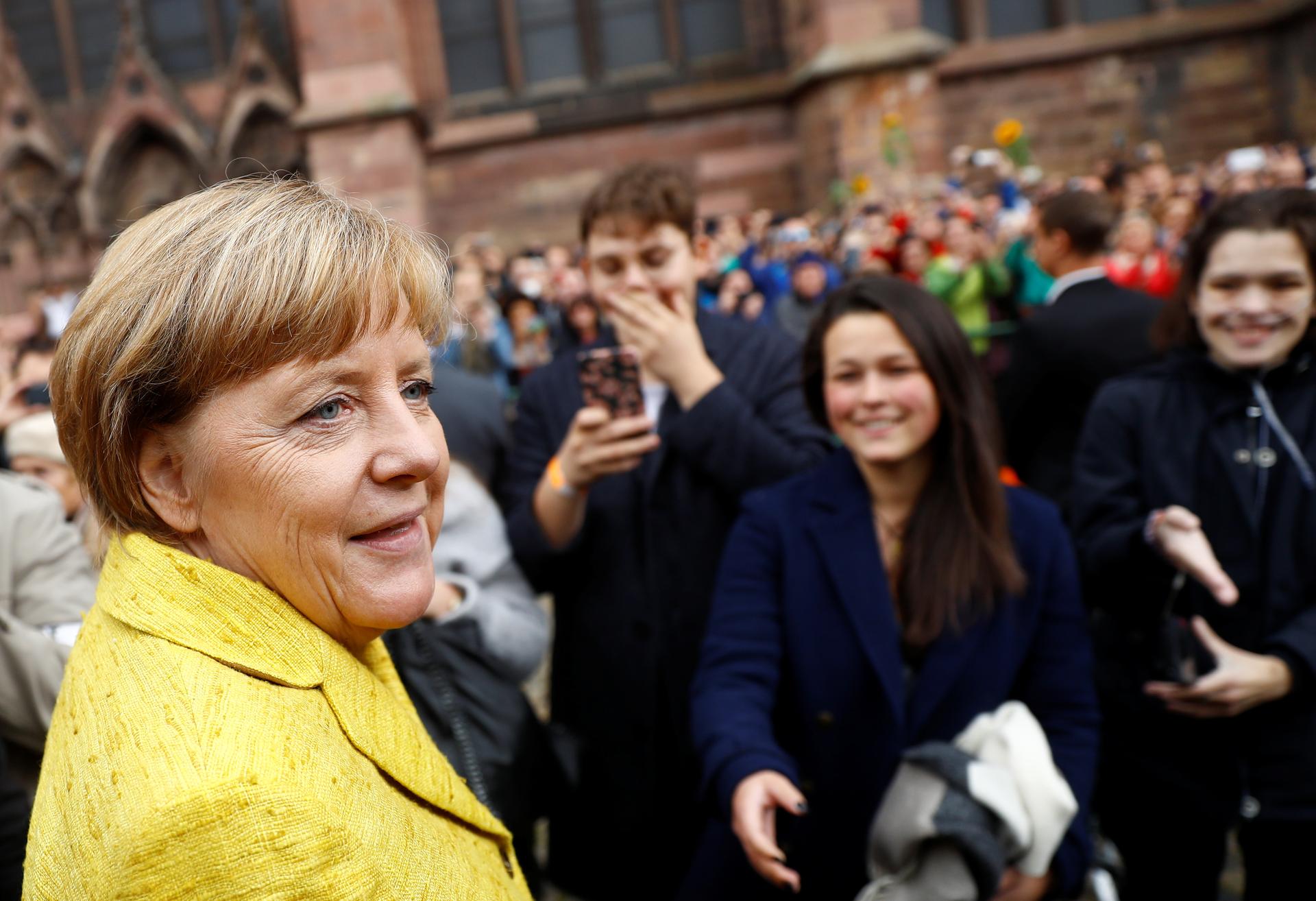 German Chancellor Angela Merkel, the top candidate of the Christian Democratic Union Party (CDU) for the upcoming general elections, greets supporters during a campaign rally.
